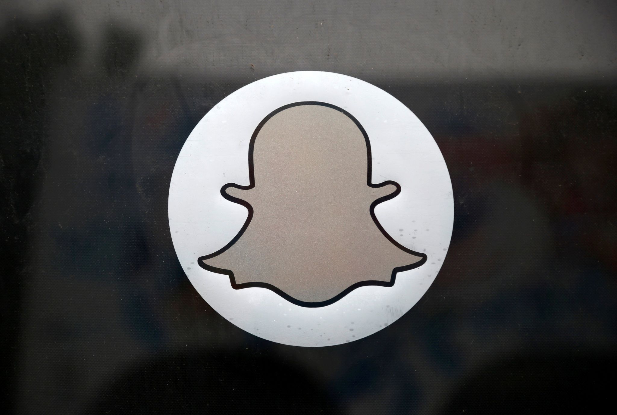 The Snapchat logo is seen on the door of their headquarters in Venice, Los Angeles, California 13 October 2014