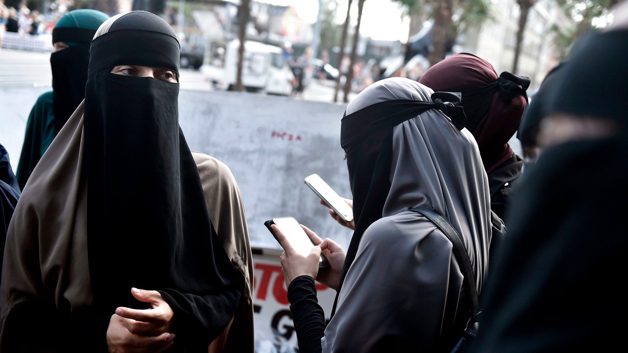 Women wearing niqab to veil their faces take part in a demonstration on August 1, 2018