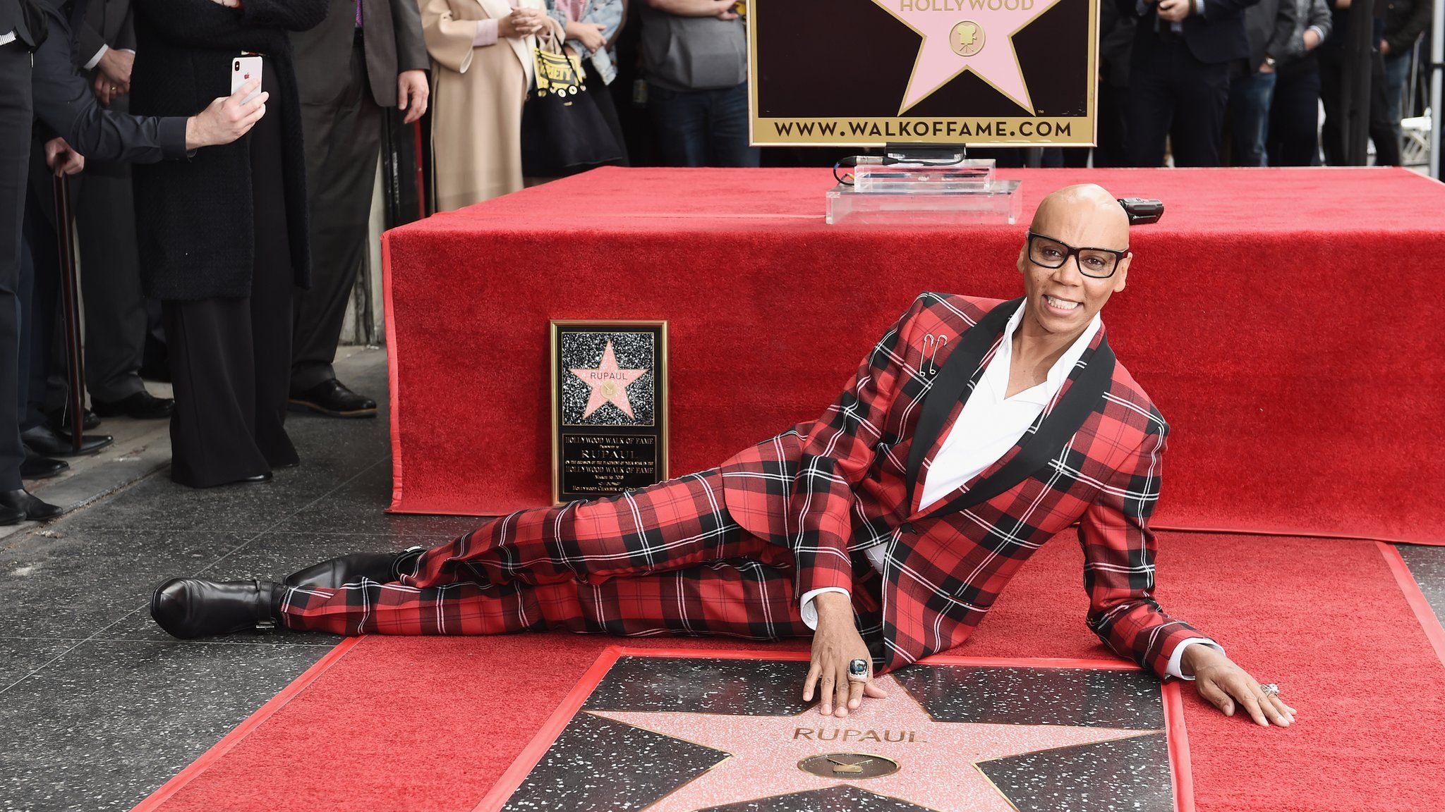 RuPaul poses with his star