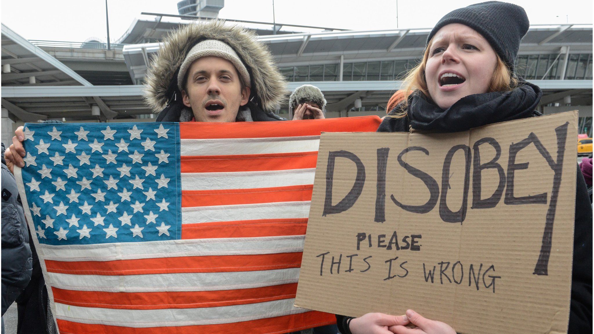 Protesters rally during a protest against the Muslim immigration ban at John F. Kennedy International Airport on January 28, 2017 in New York City