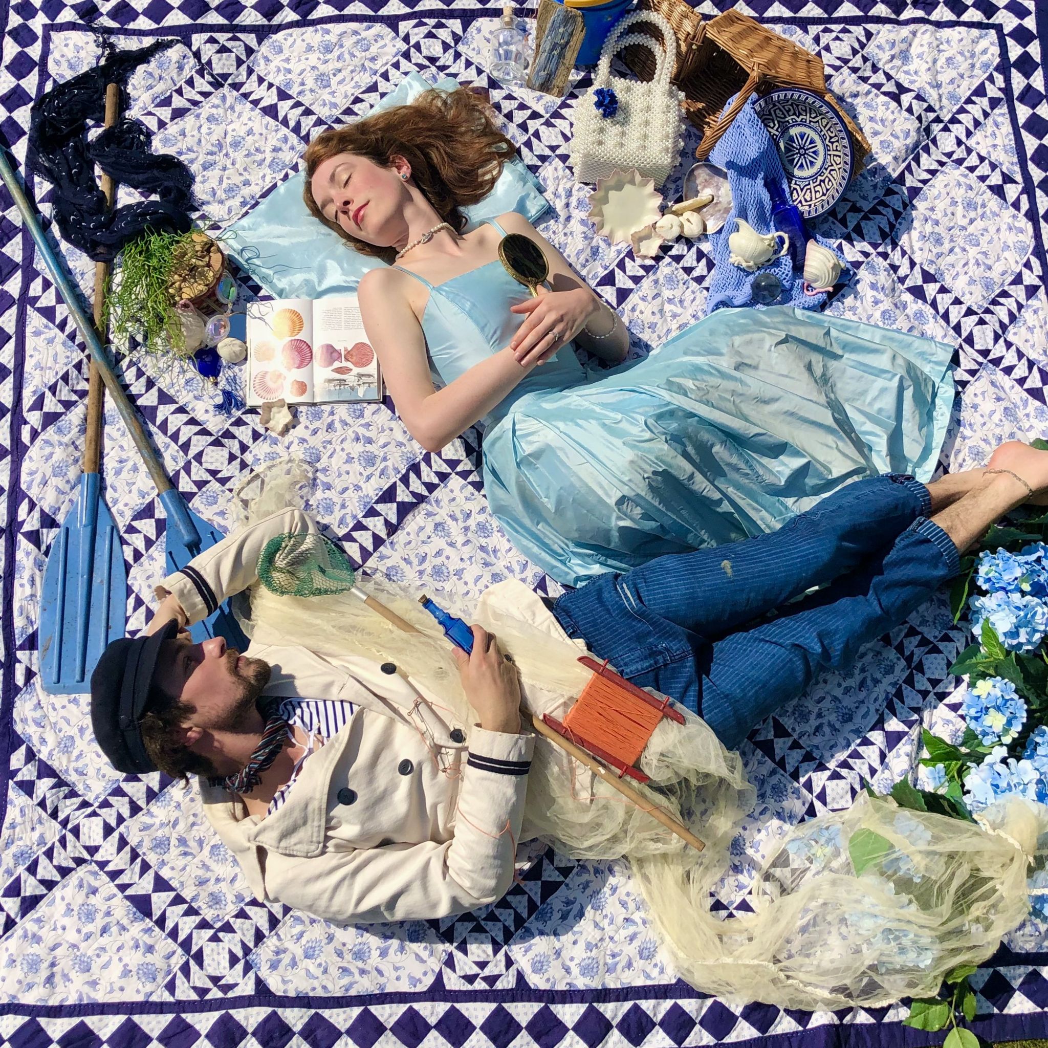 Helen Yang and Thomas Etheridge in blue outfits