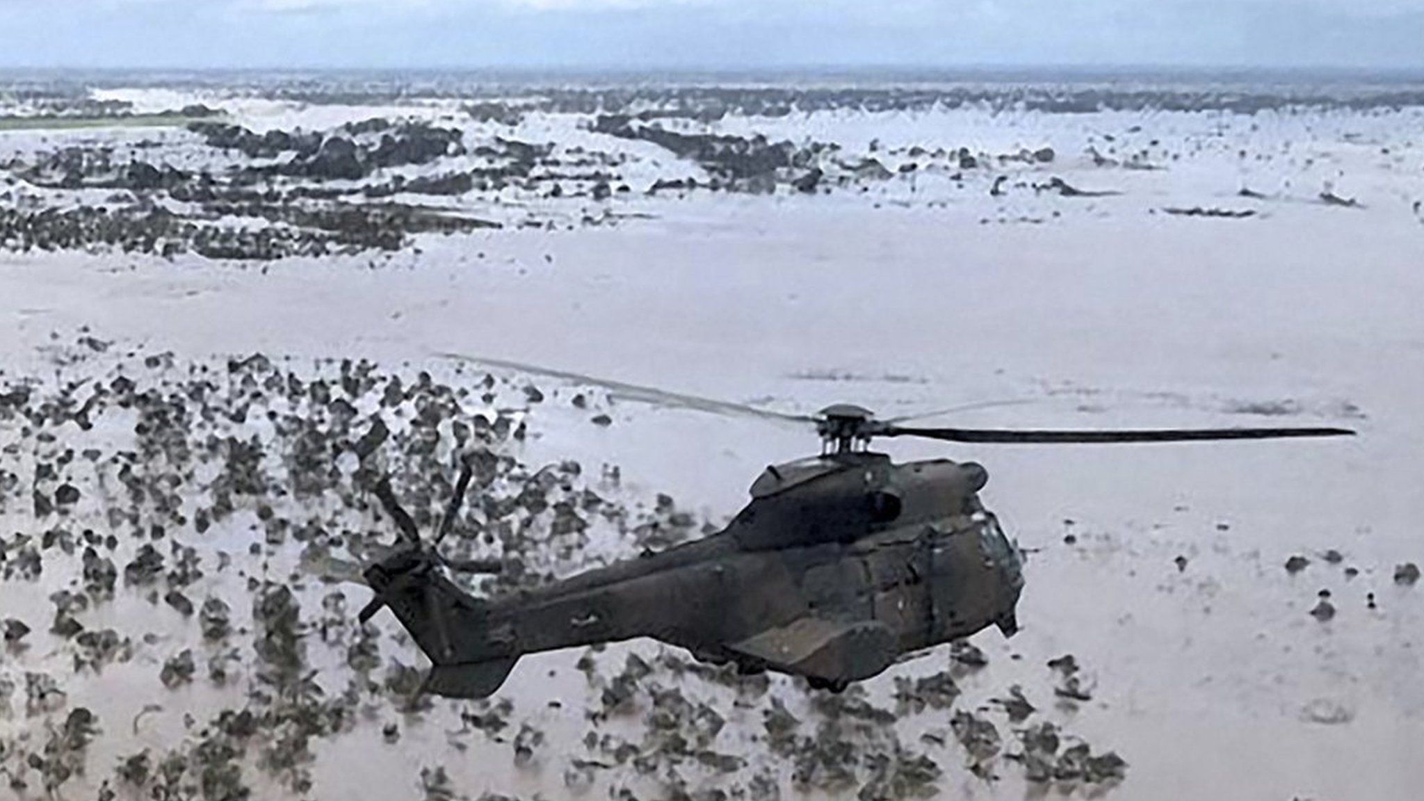 Helicopters over cyclone-hit plains, Mozambique