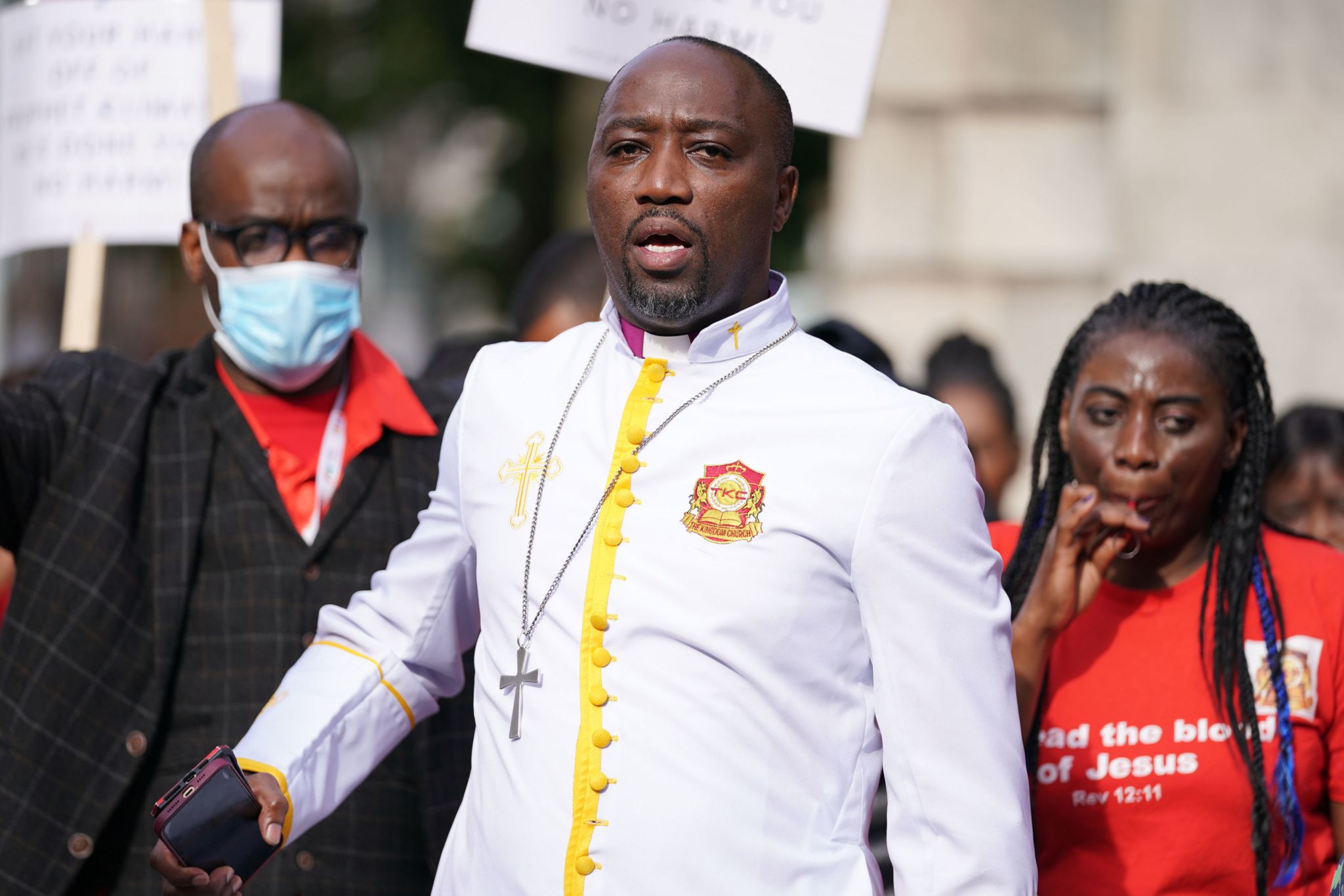 Bishop Climate Wiseman, 46, is greeted by his supporters outside Inner London Crown Court