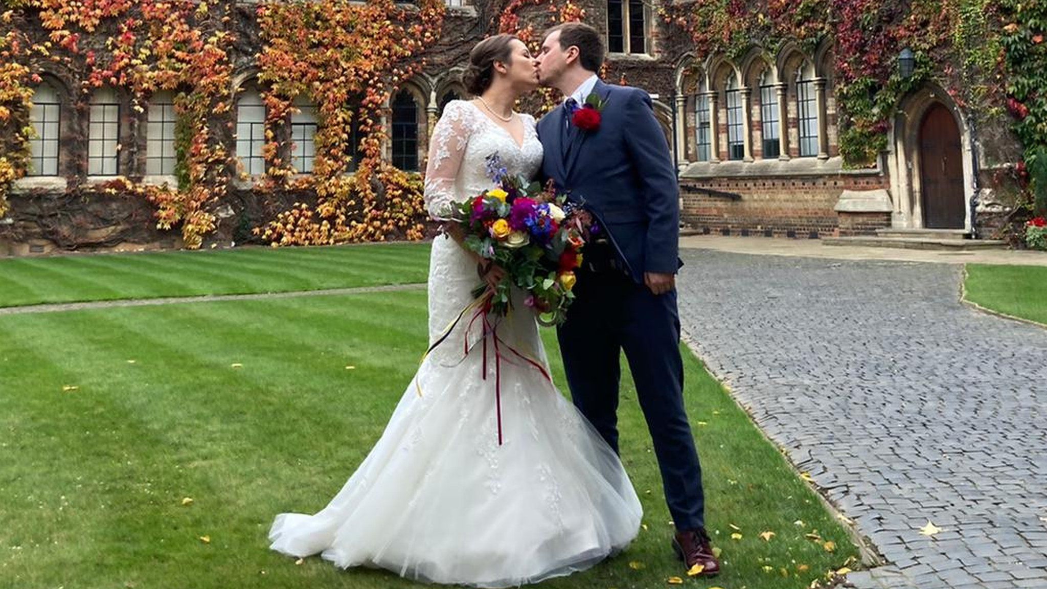 Megan and Tristan kissing after getting married