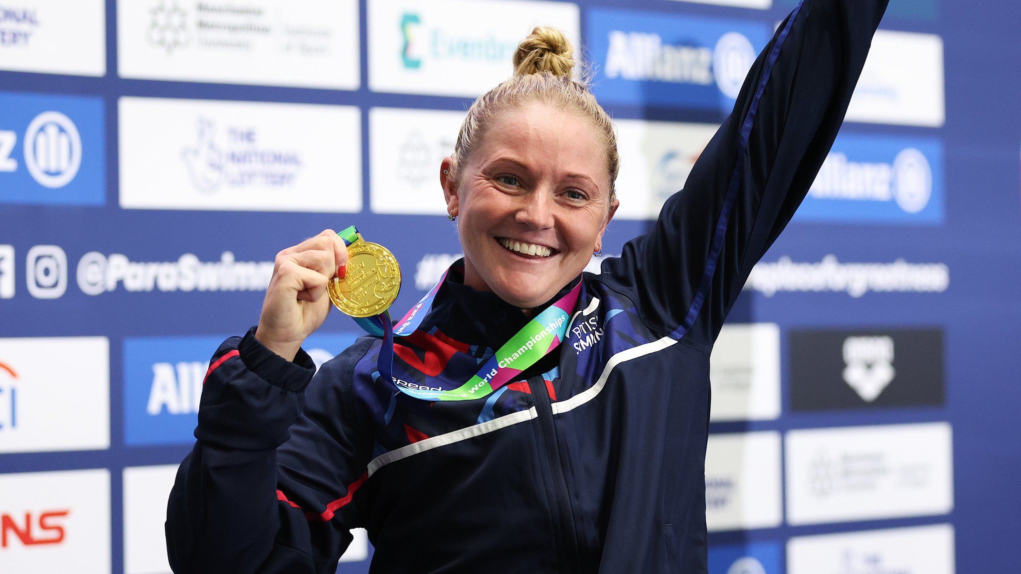 Suzanna Hext with her gold medal on the podium after winning the 50m freestyle world title