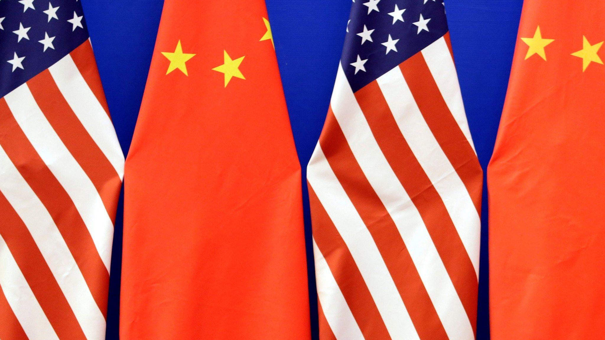 US and Chinese national flags, side by side in the Great Hall of the People in Beijing, China, July 10, 2014.
