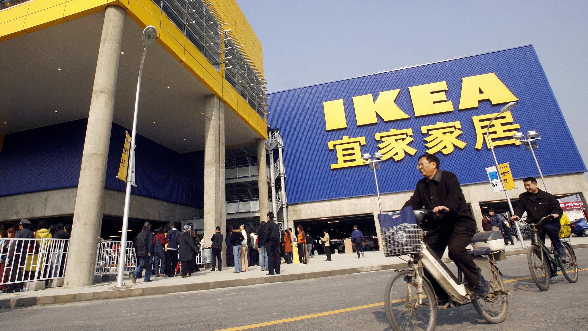 Customers cycle past an Ikea in China's west Chengdu
