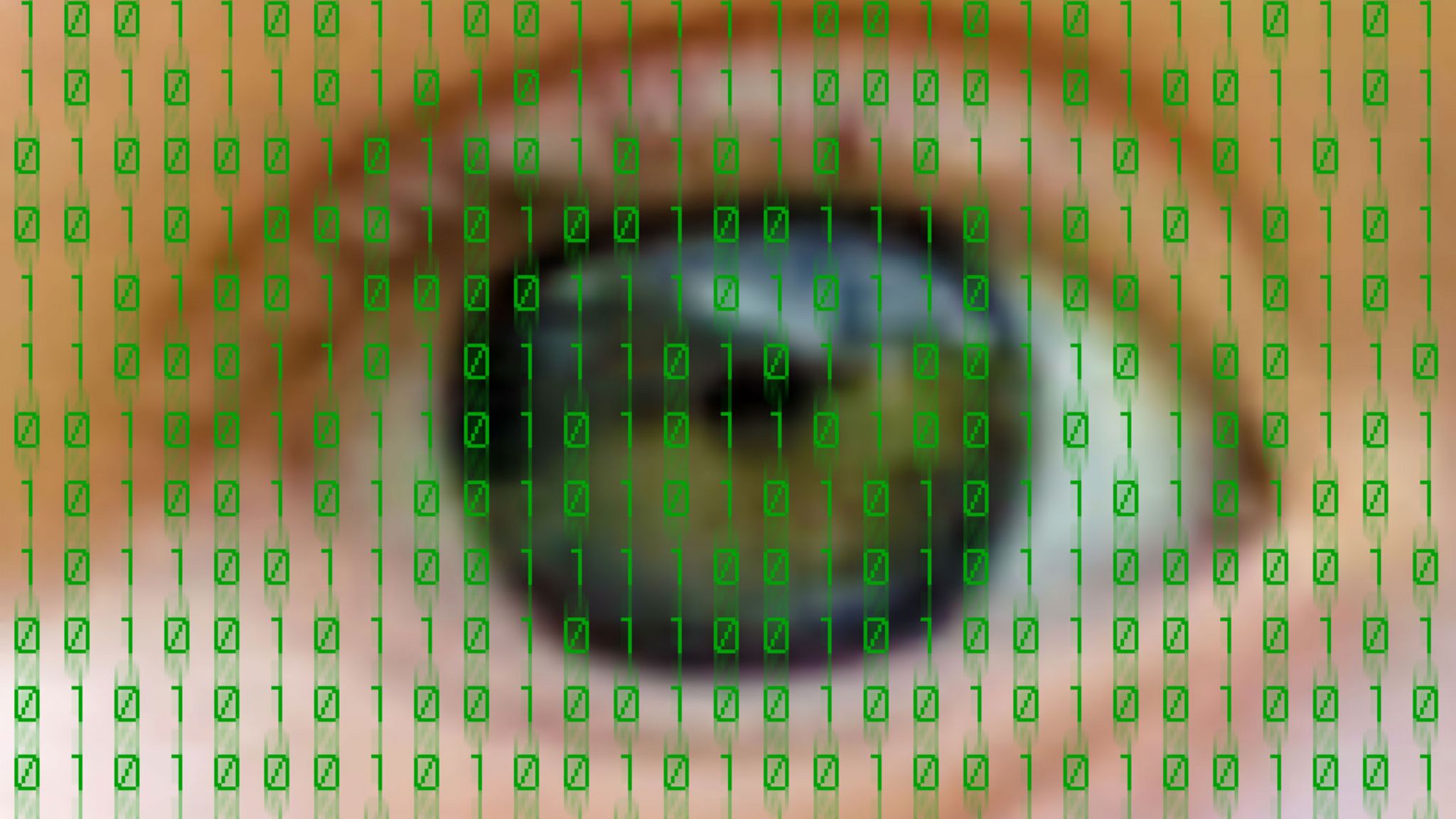 Close-up of eye overlaid with binary code