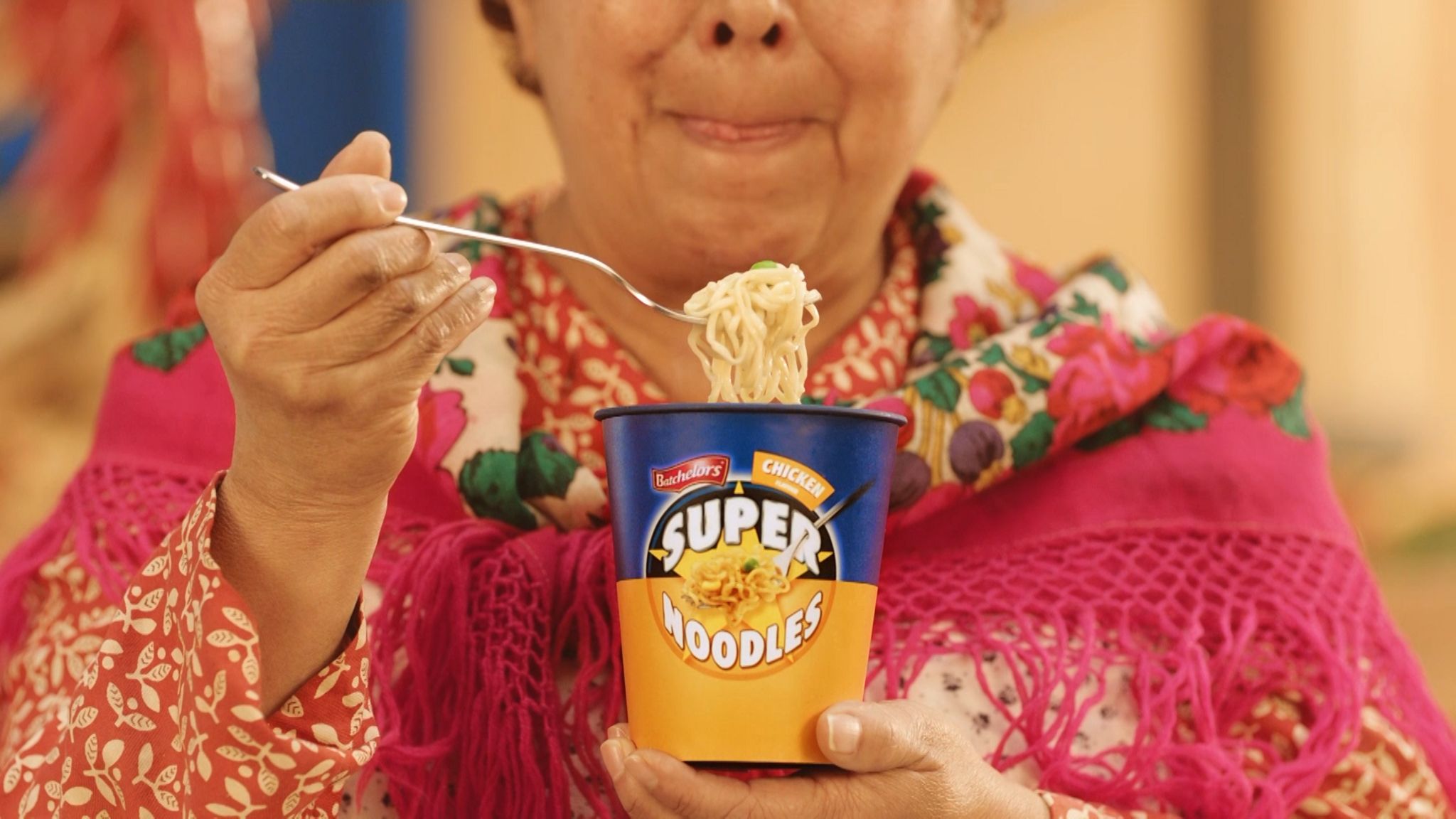 Woman eating super noodles