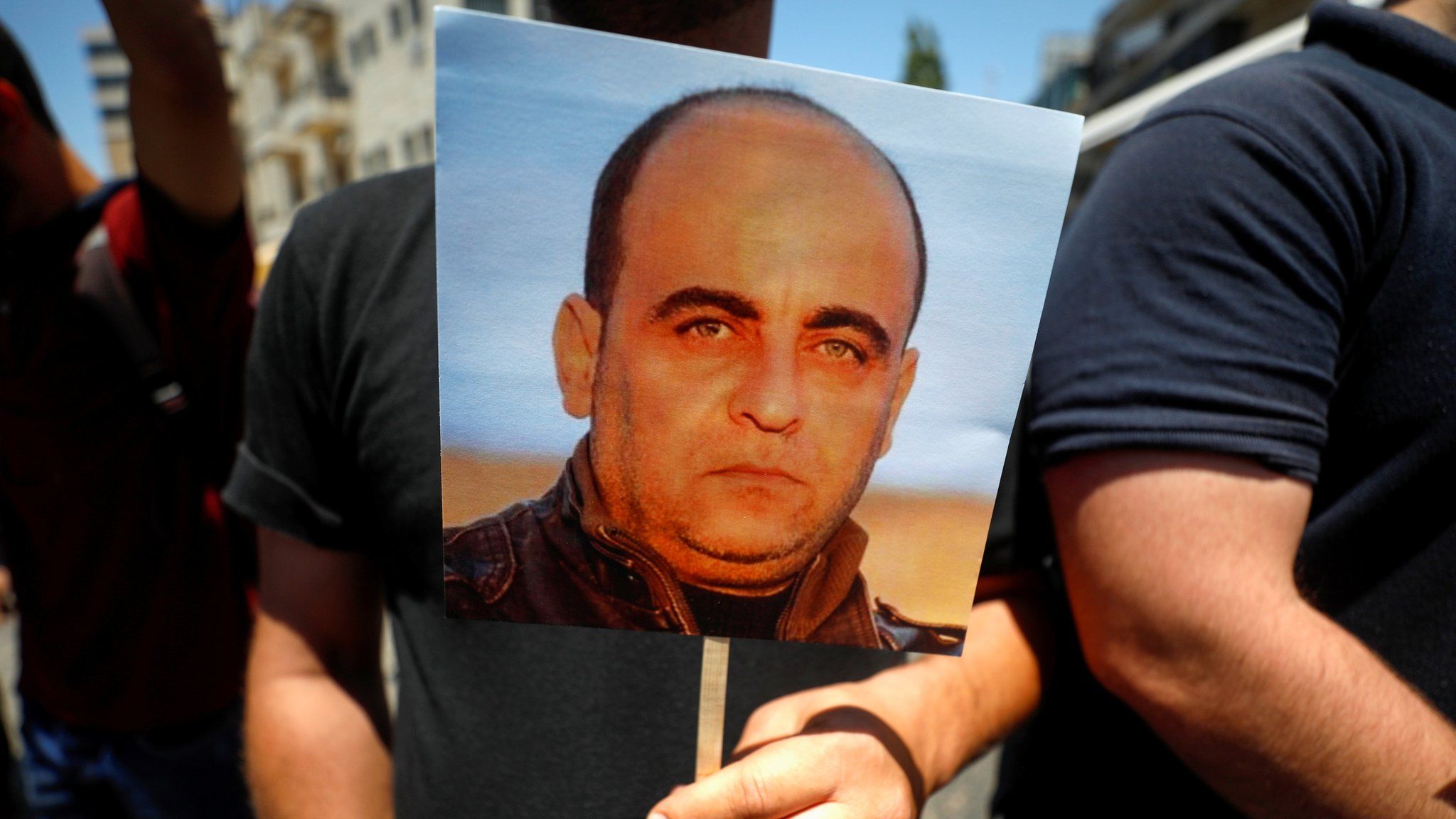Palestinians protest against the death in custody of activist Nizar Banat in Ramallah, in the occupied West Bank (24 June 2021)