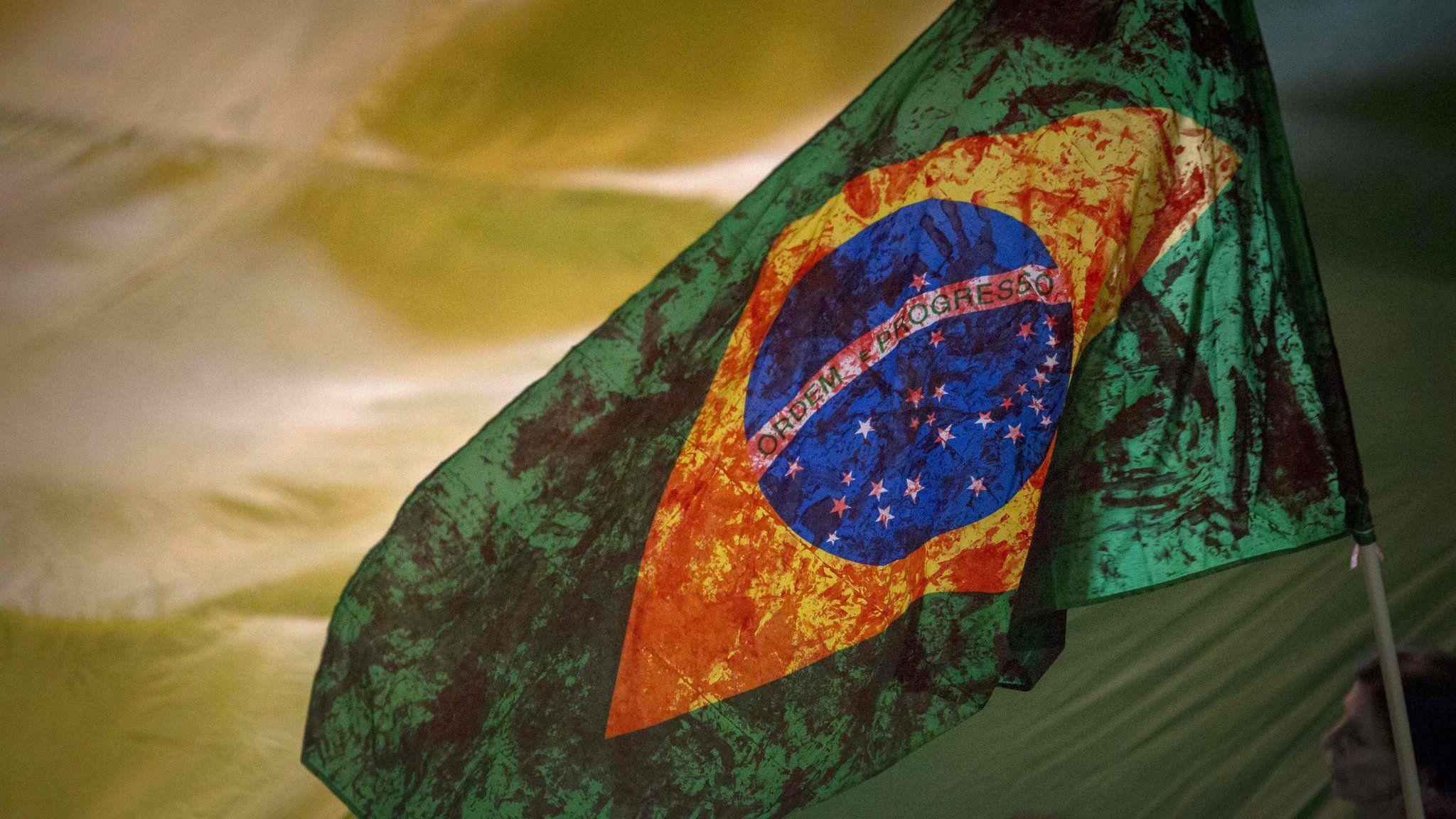 A Brazilian flag stained with fake blood used in a rally by demonstrators in April 2018