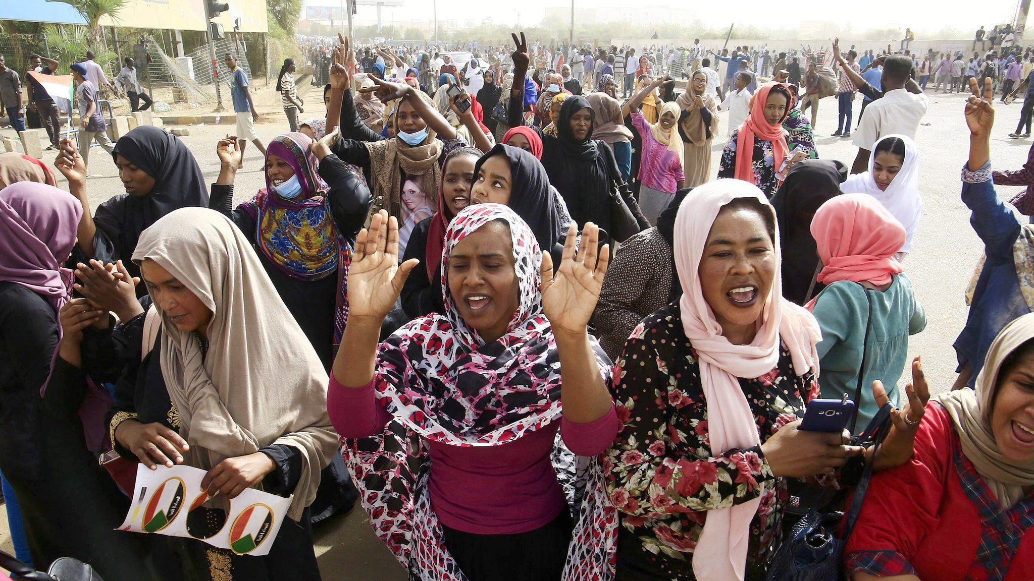 Sudanese people celebrate as they head towards the Army headquarters amid rumors that President Omar al-Bashir has stepped down, in Khartoum, Sudan, 11 April 2019