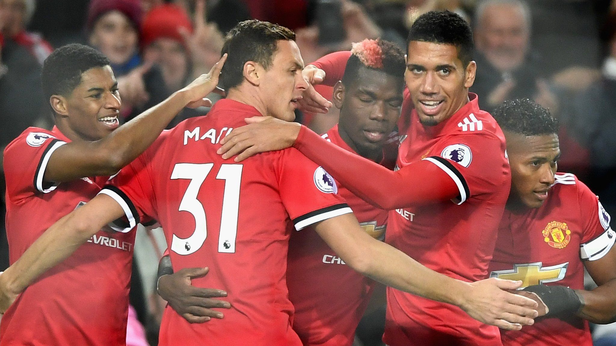 Manchester United's players celebrate scoring against Newcastle United