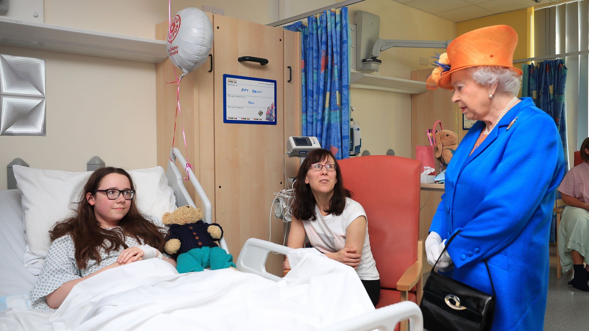 Amy Barlow, 12, with the Queen at the Royal Manchester Children's Hospital