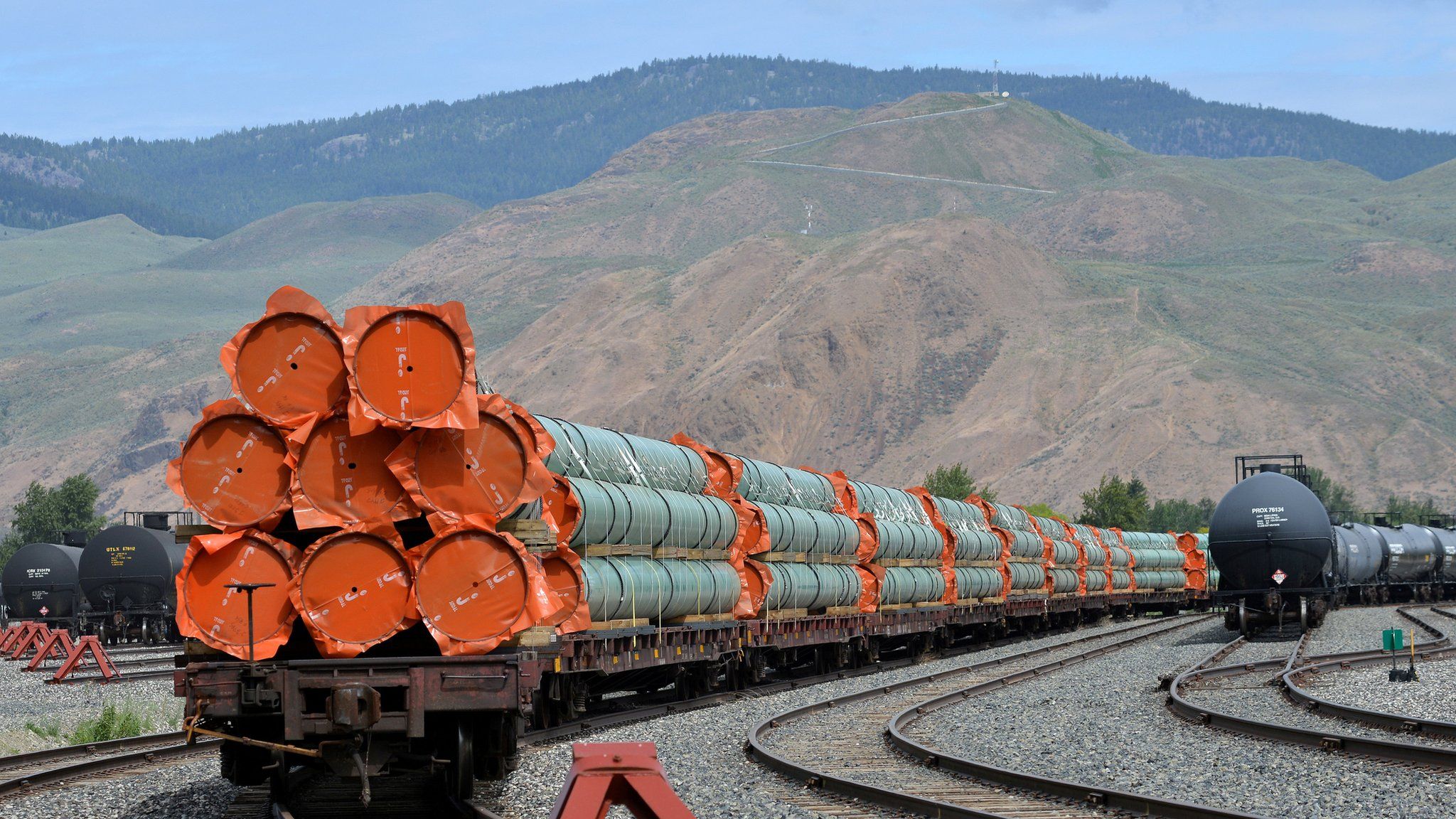 Steel pipe to be used in the oil pipeline construction of Kinder Morgan Canada"s Trans Mountain Expansion Project sit on rail cars at a stockpile site in Kamloops, British Columbia,