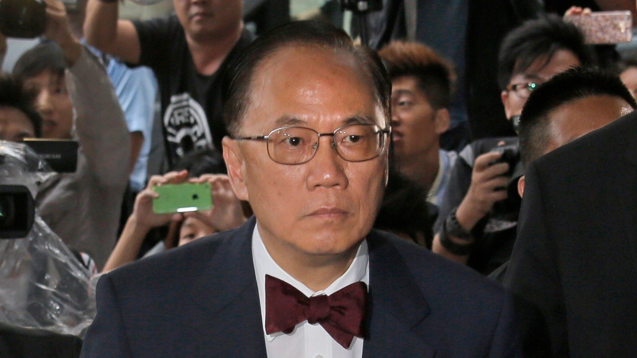 Donald Tsang arrives at a magistrate's court in Hong Kong