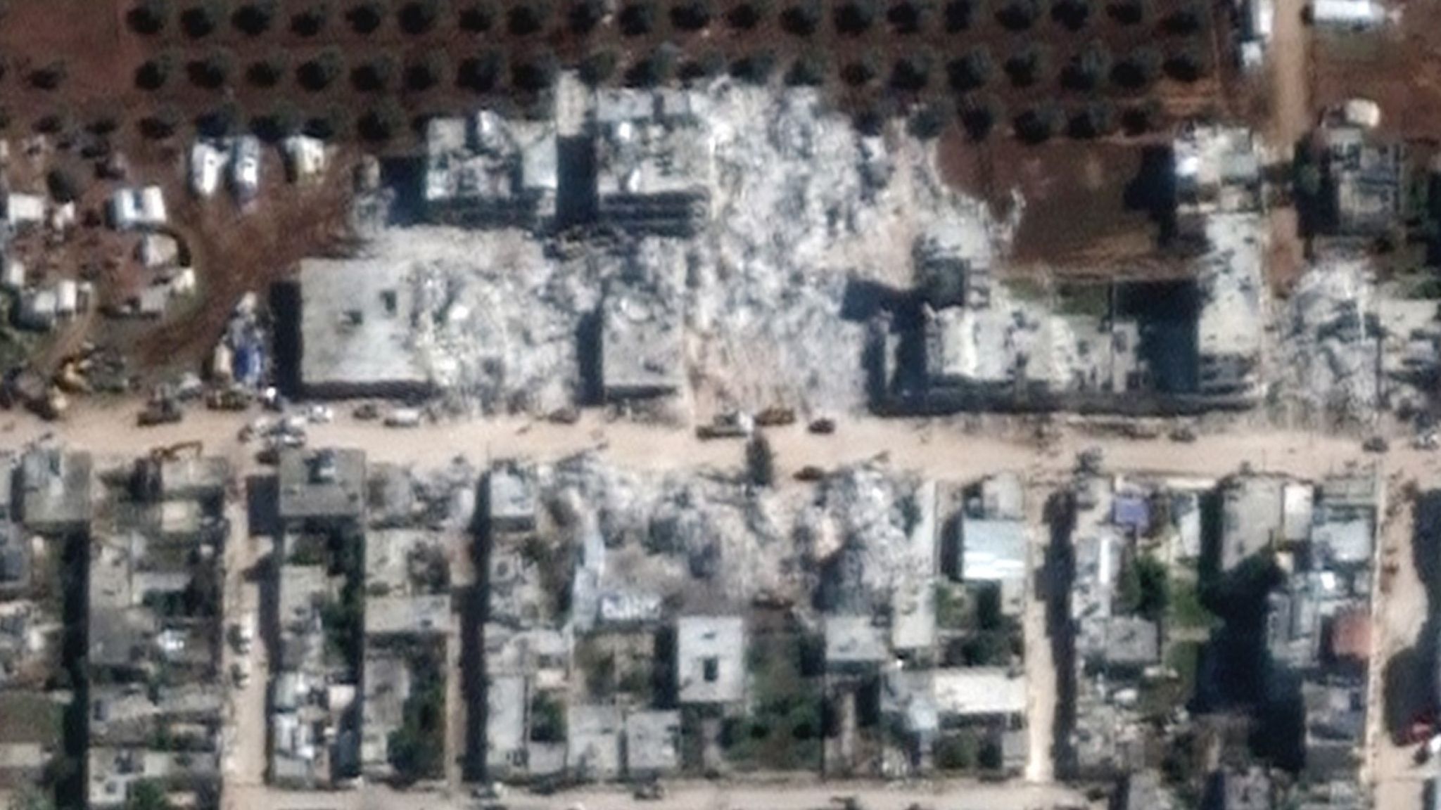 Satellite image from 11 February 2023 showing flattened buildings in Jindayris, north-western Syria