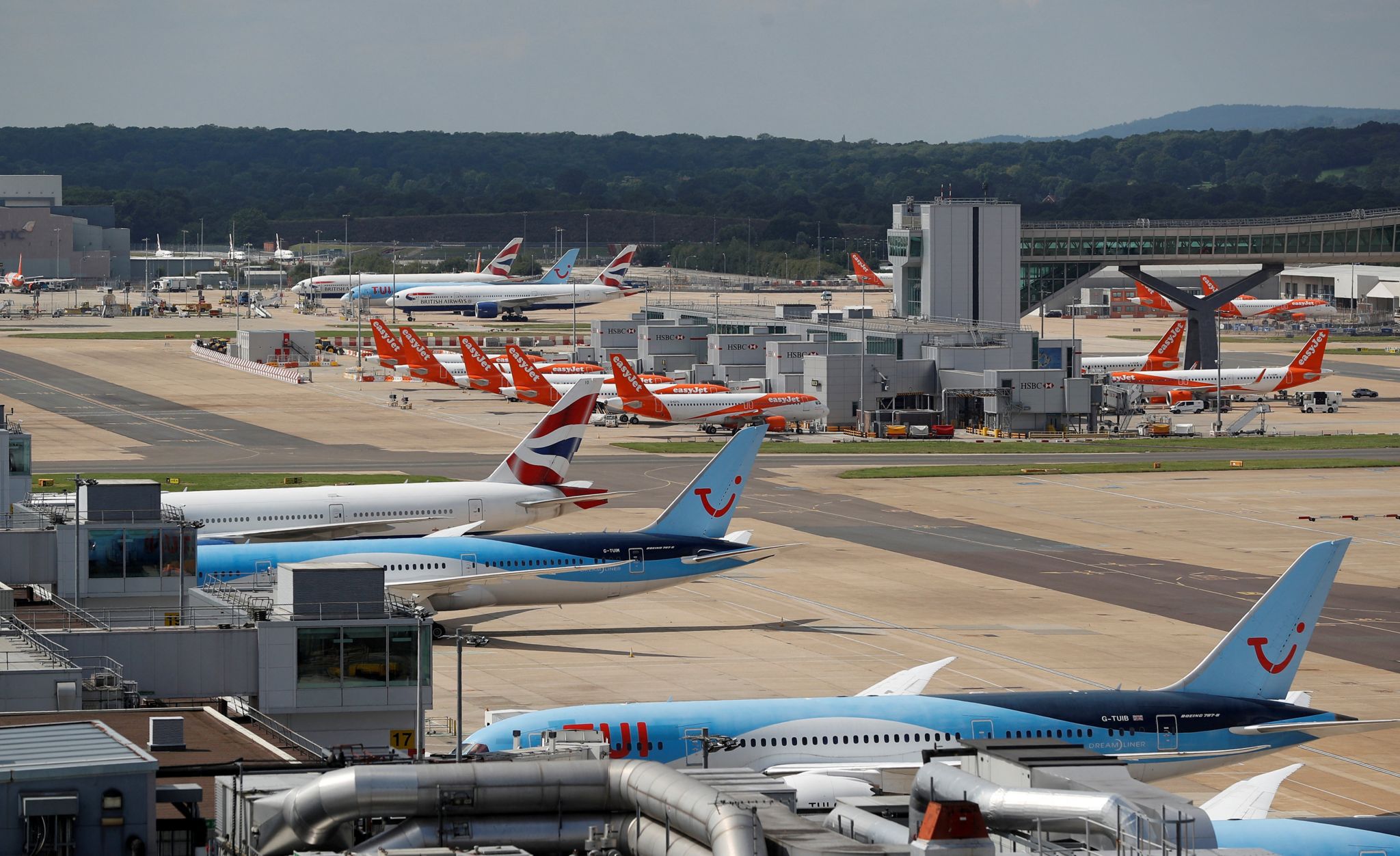 British Airways, Easyjet and TUI aircraft are parked at the South Terminal at Gatwick Airport