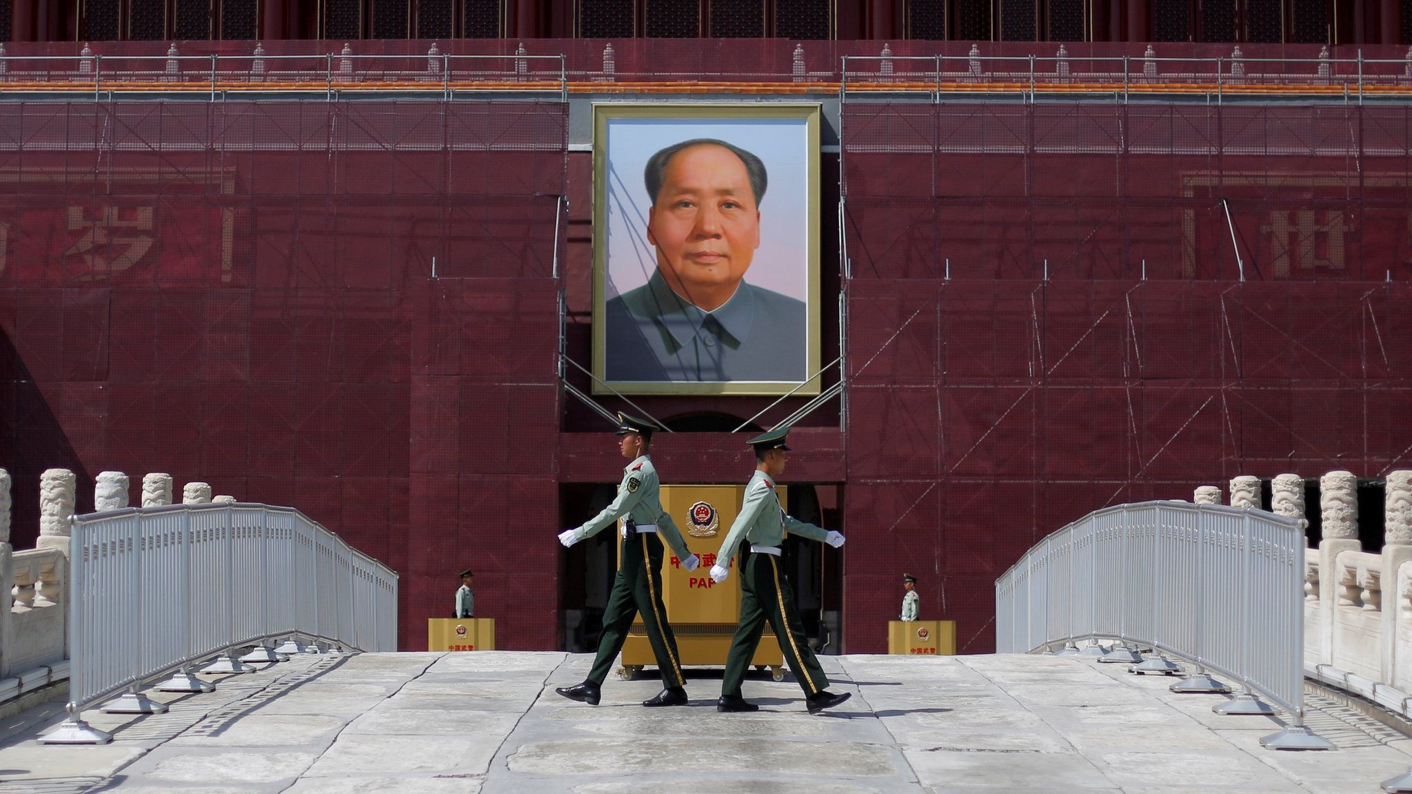 Paramilitary officers change guard in front of the portrait of the late Chinese chairman Mao Zedong in Tiananmen Square in Beijing, China May 7, 2019