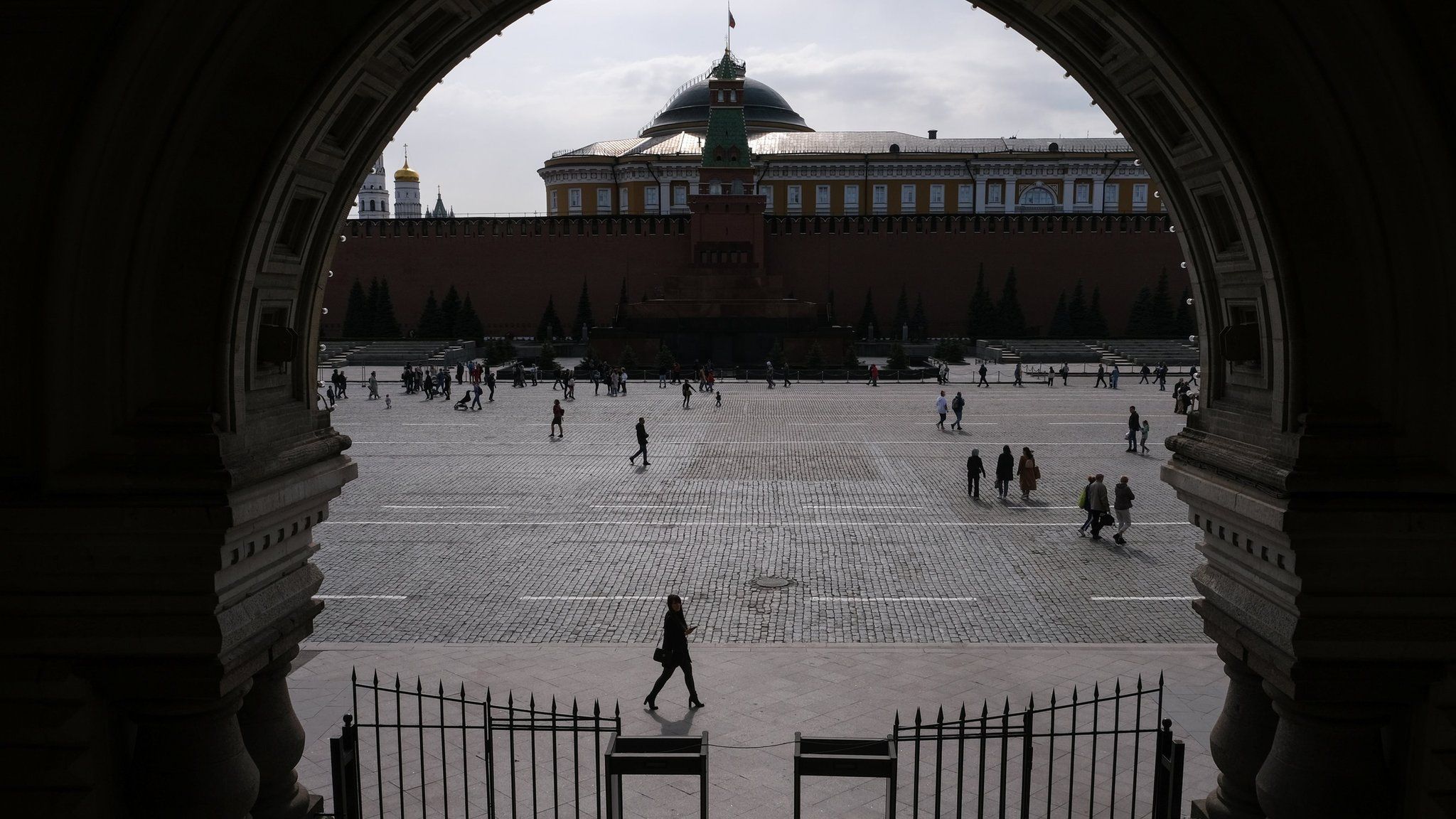 People walk along Red Square in Moscow, Russia