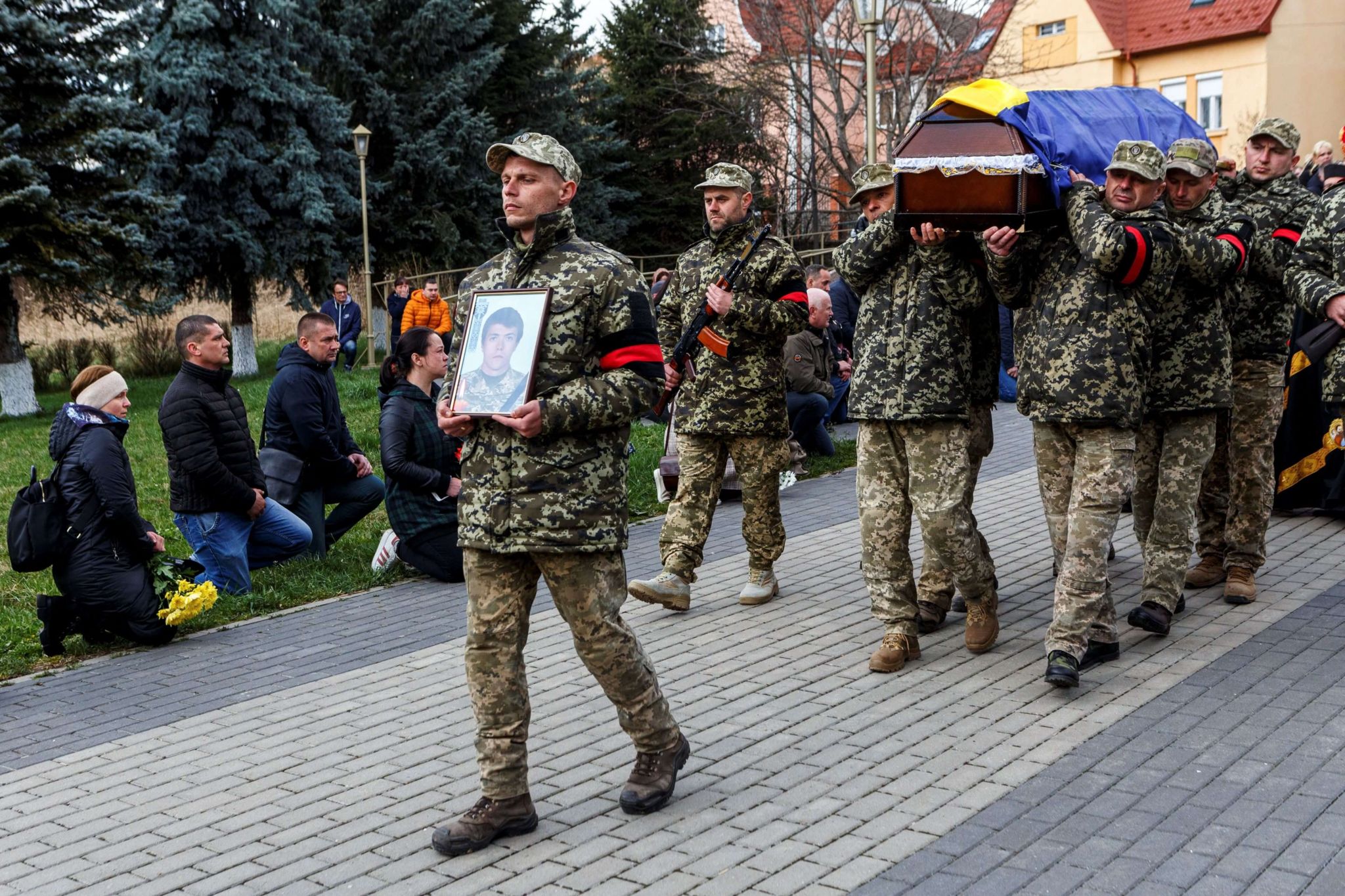 Photo of Ukrainian soldiers carrying the coffin of their fallen colleague, Sviatoslav Soyko, during his funeral in Uzhhorod, Ukraine. The young man died during the conflict with Russia.