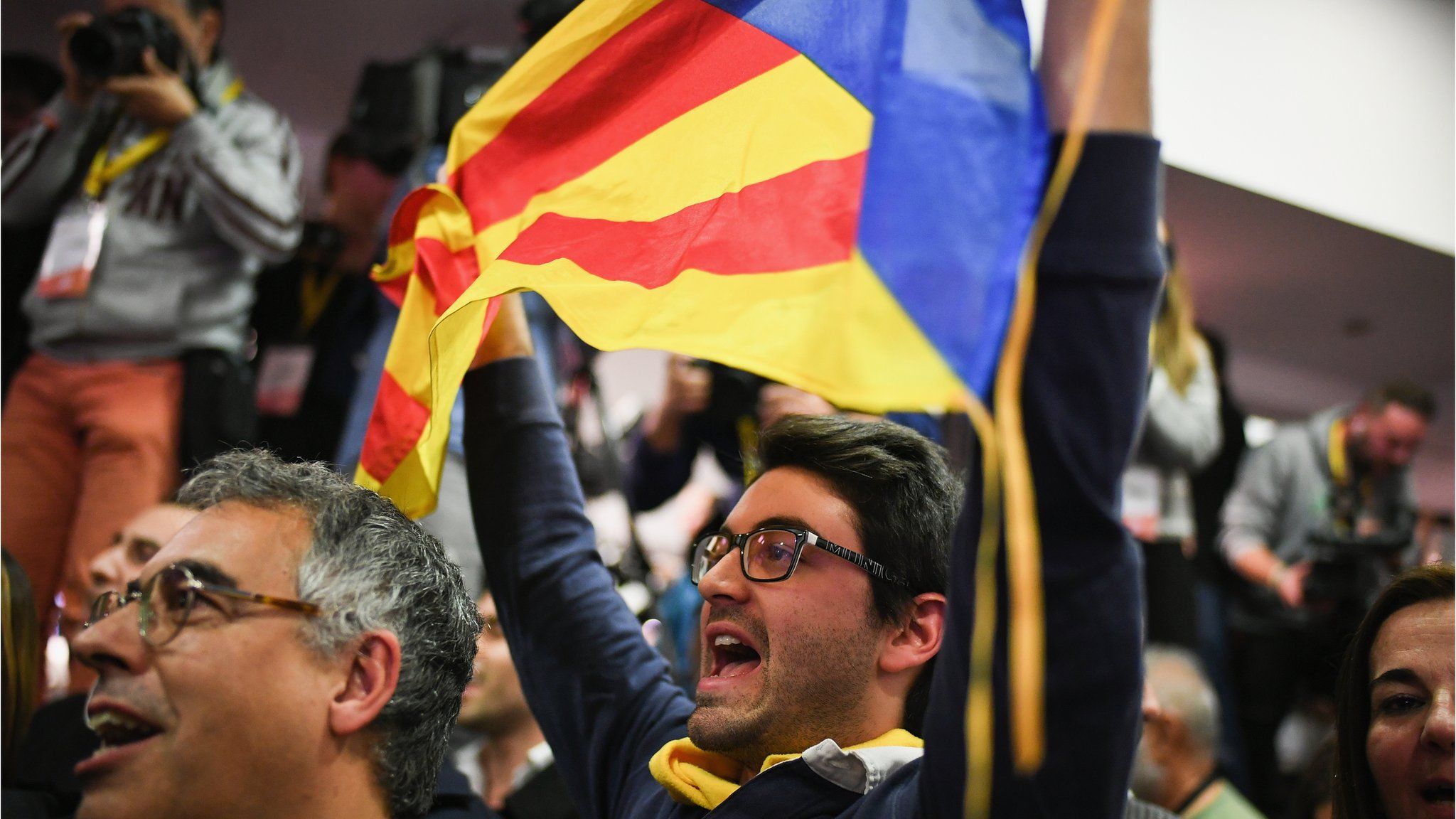 Junts Per Catalunya supporters celebrate following the Catalan regional election in on December 21, 2017 in Barcelona, Spain