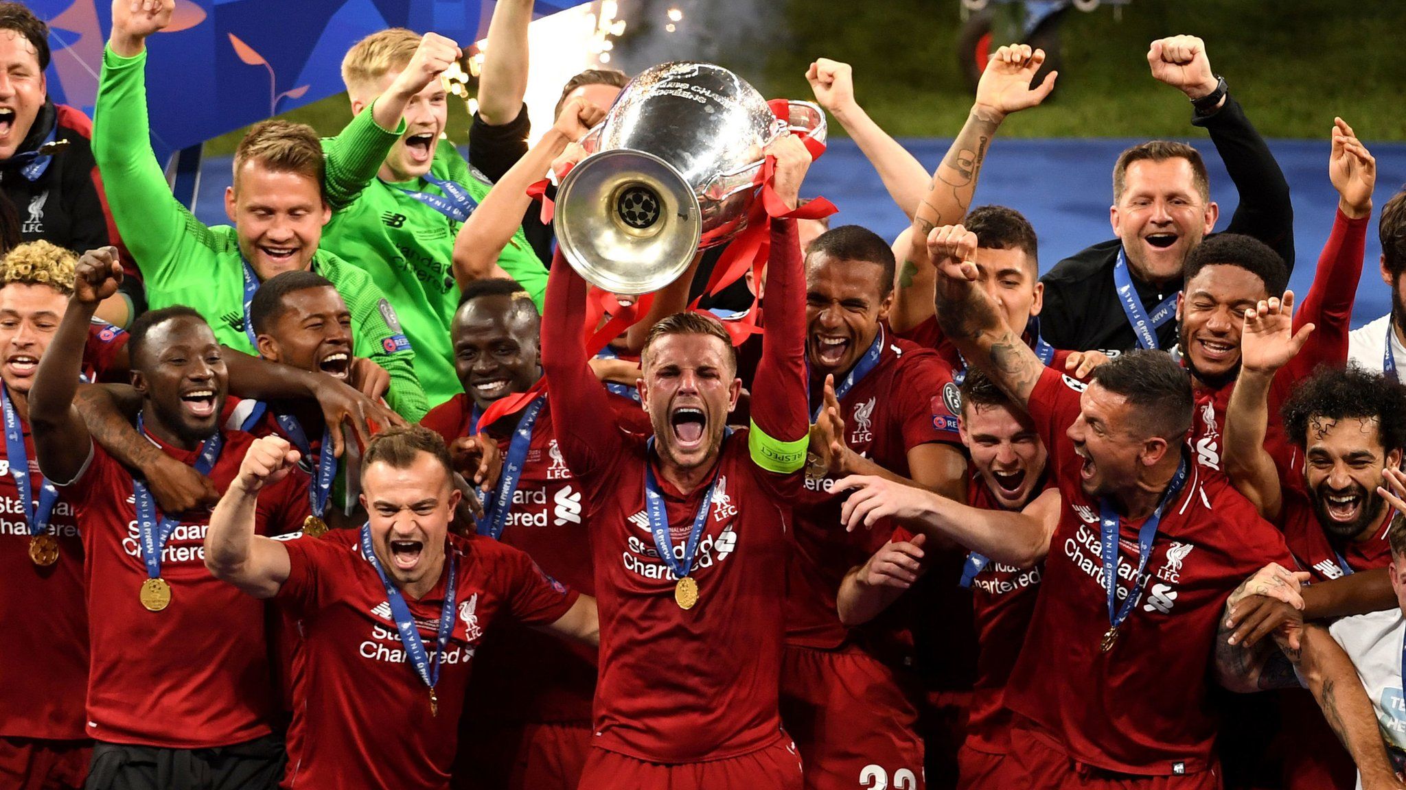 Jordan Henderson (centre) lifts Champions League trophy