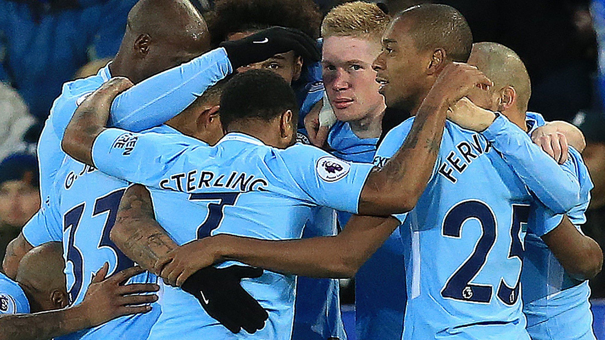 Manchester City players celebrate scoring against Leicester