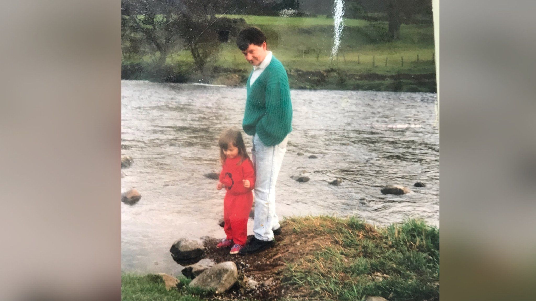 Sarah with her dad by a river
