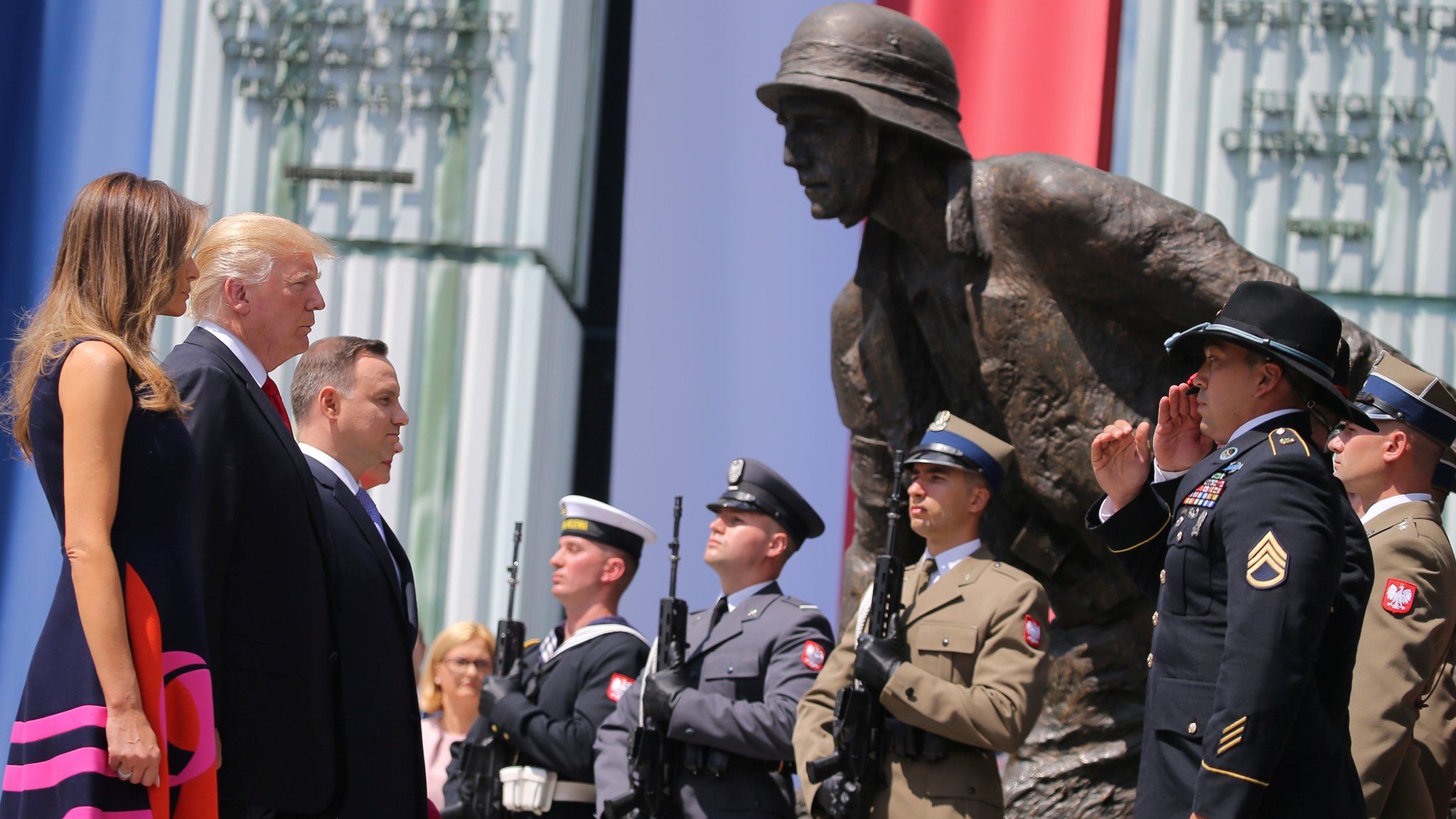 Donald Trump with his wife and Polish leaders at the Uprising Monument in Warsaw on 6 July 2017