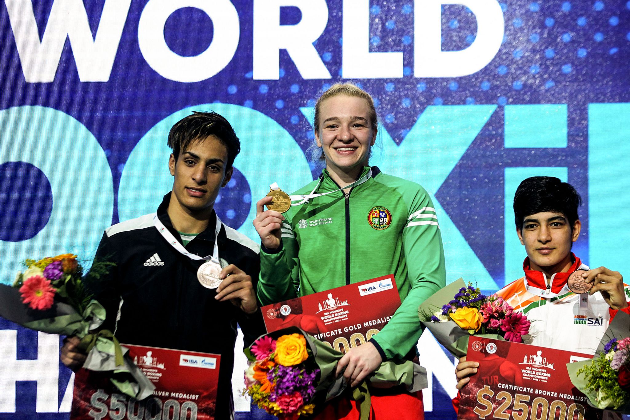 Algeria's Imane Khelif with the silver medal, Ireland's Amy Broadhurst with the gold medal and Parveen of India with the bronze medal