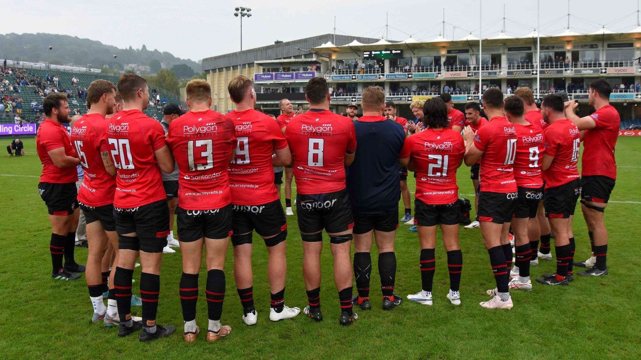 Jersey players huddle together on the pitch following their game against Bath this season