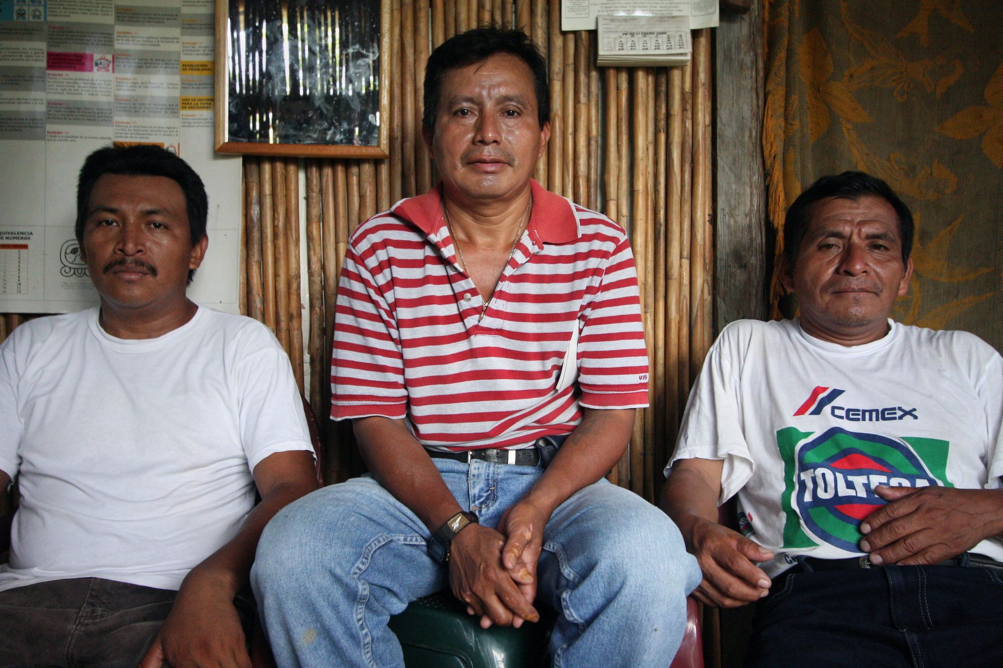 Community leaders Haroldo Cucul (left), Adolfo Ich (middle) and Carlos Xol pose for a photo in El Estor, Izabal, Guatemala on June 6, 2009.