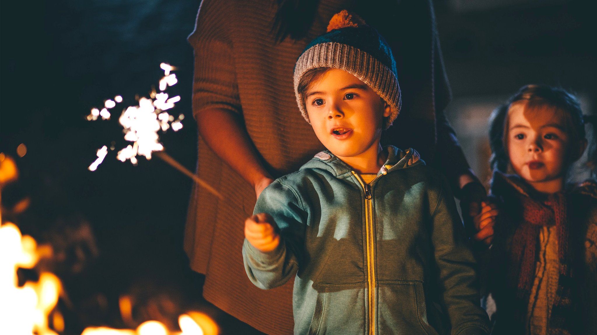 Child holding a sparkler