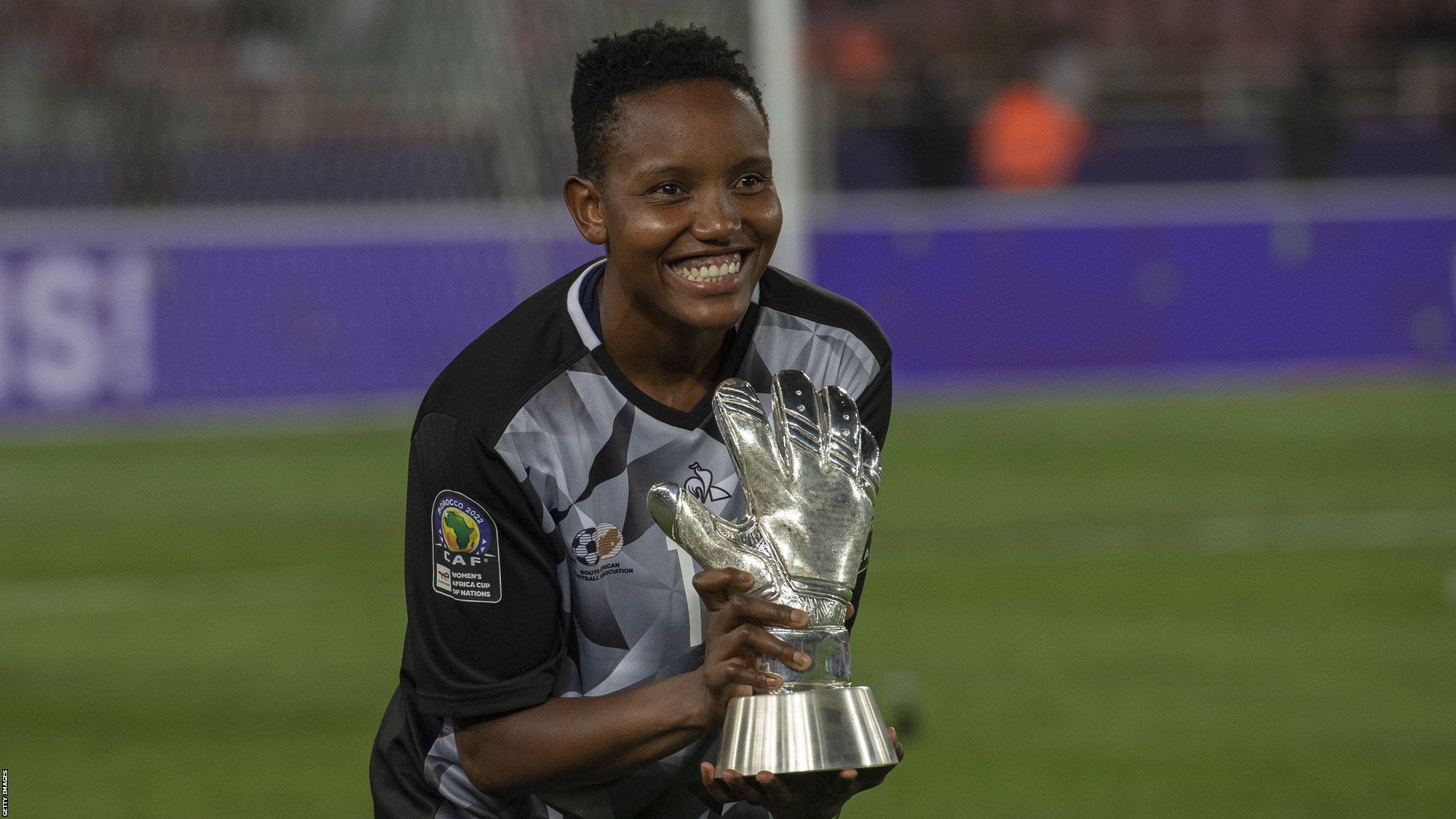 South Africa goalkeeper Andile Dlamini holds the trophy after winning the Africa Women's Cup of Nations 2022