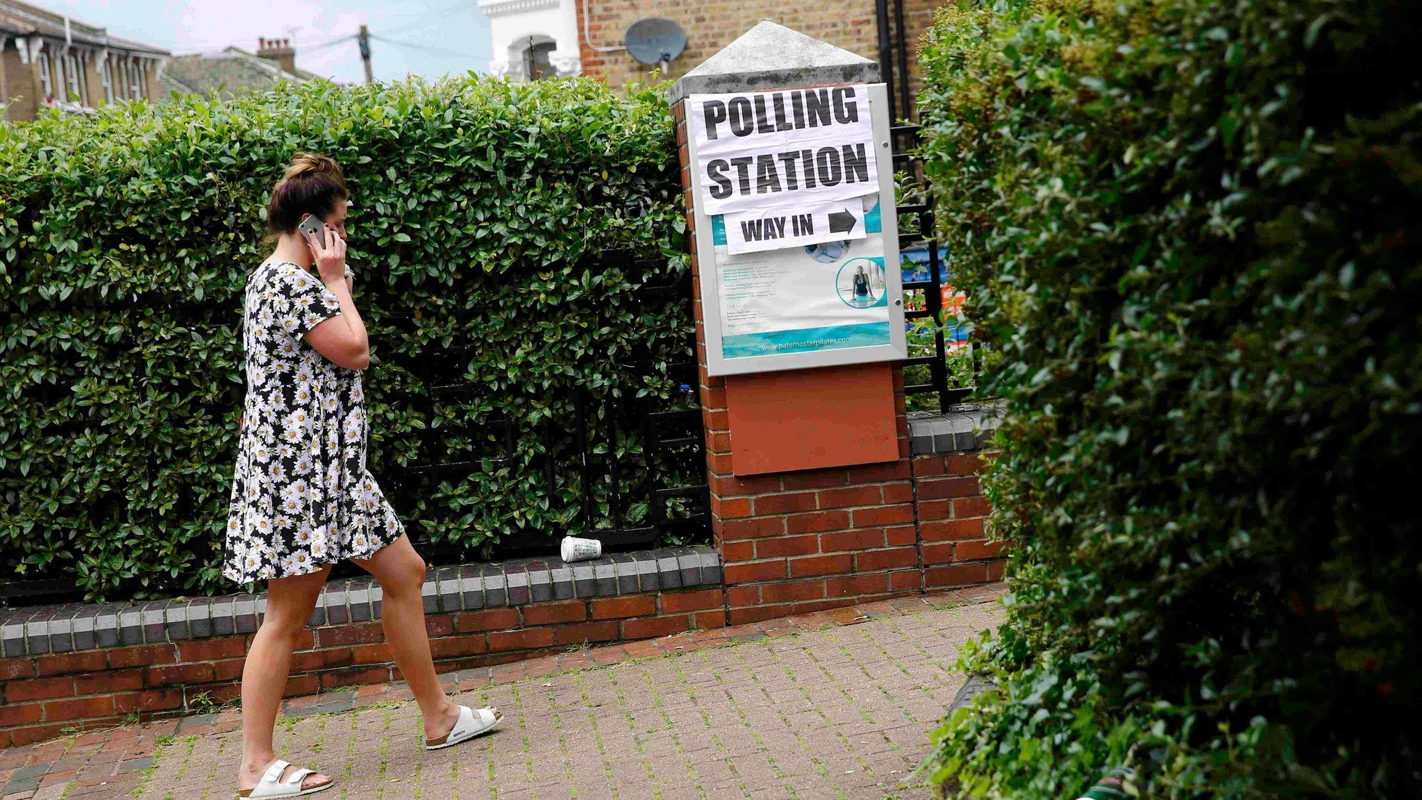 Woman entering polling station