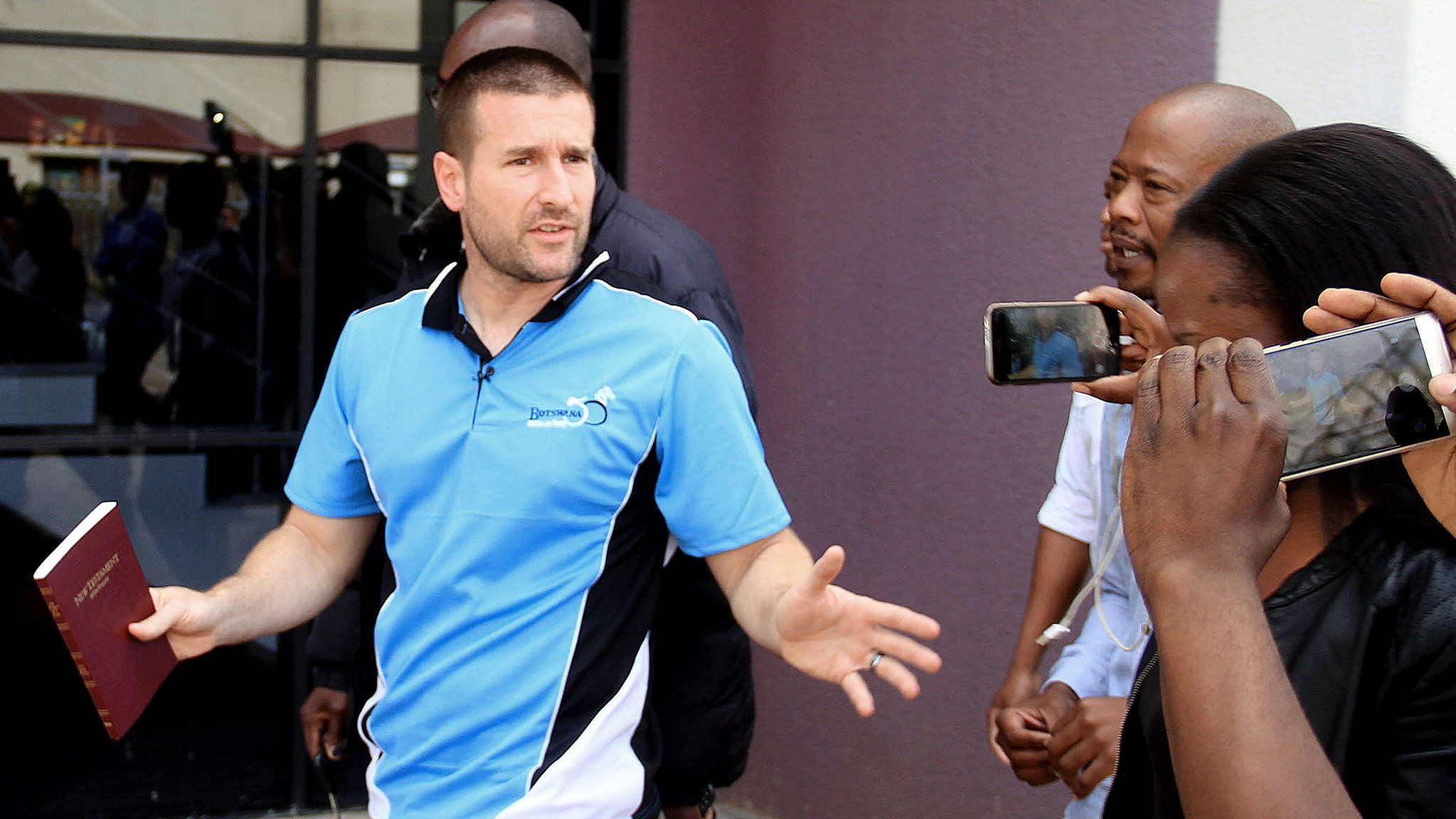 Controversial US Pastor Steven Anderson reacts as he leaves the Botswana Department of immigration after being issued a deportation order by Botswana authorities, on September 20, 2016, in Gaborone.