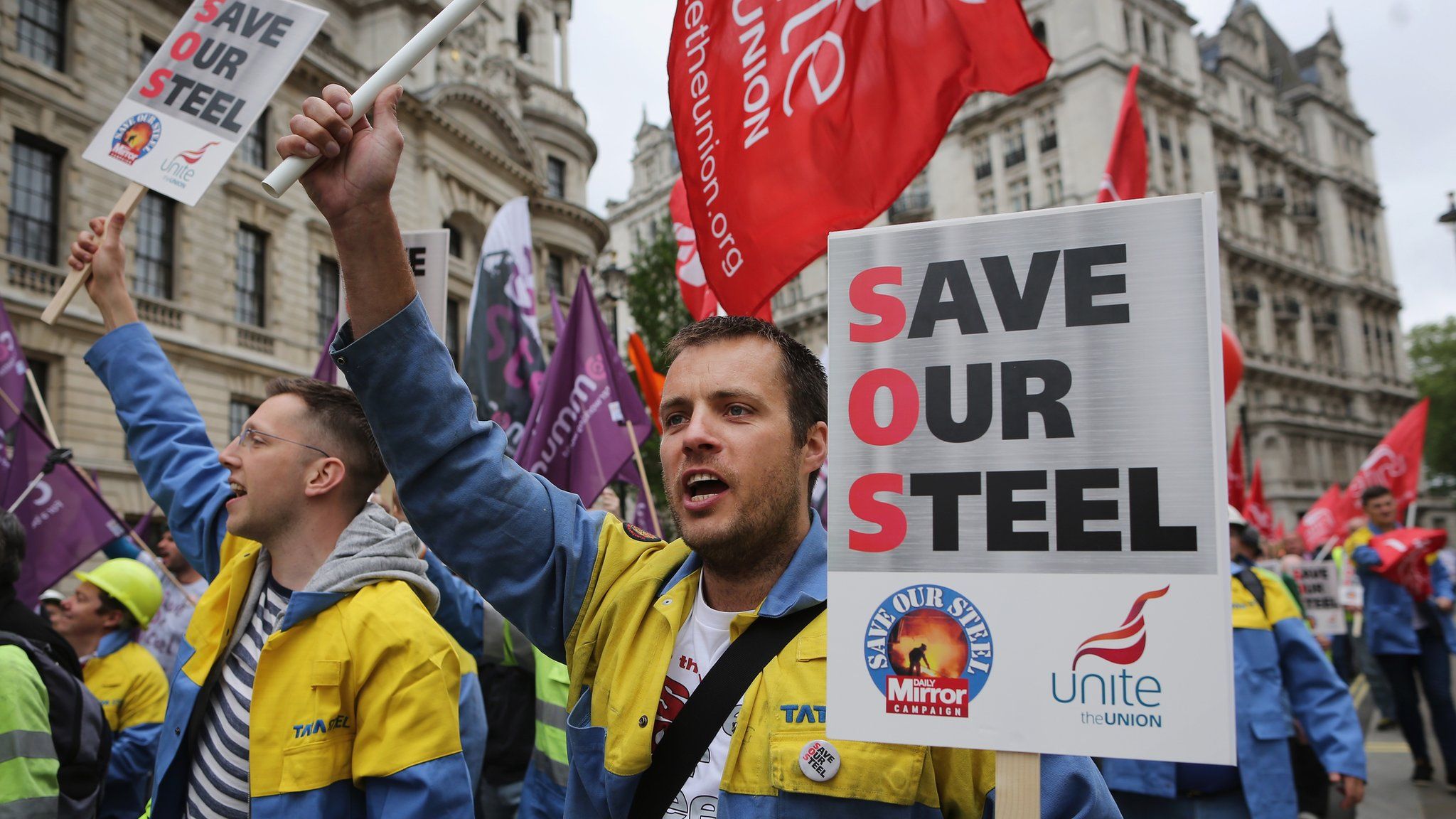 Steel workers prepare to march towards the Houses of Parliament on May 25, 2016 in London