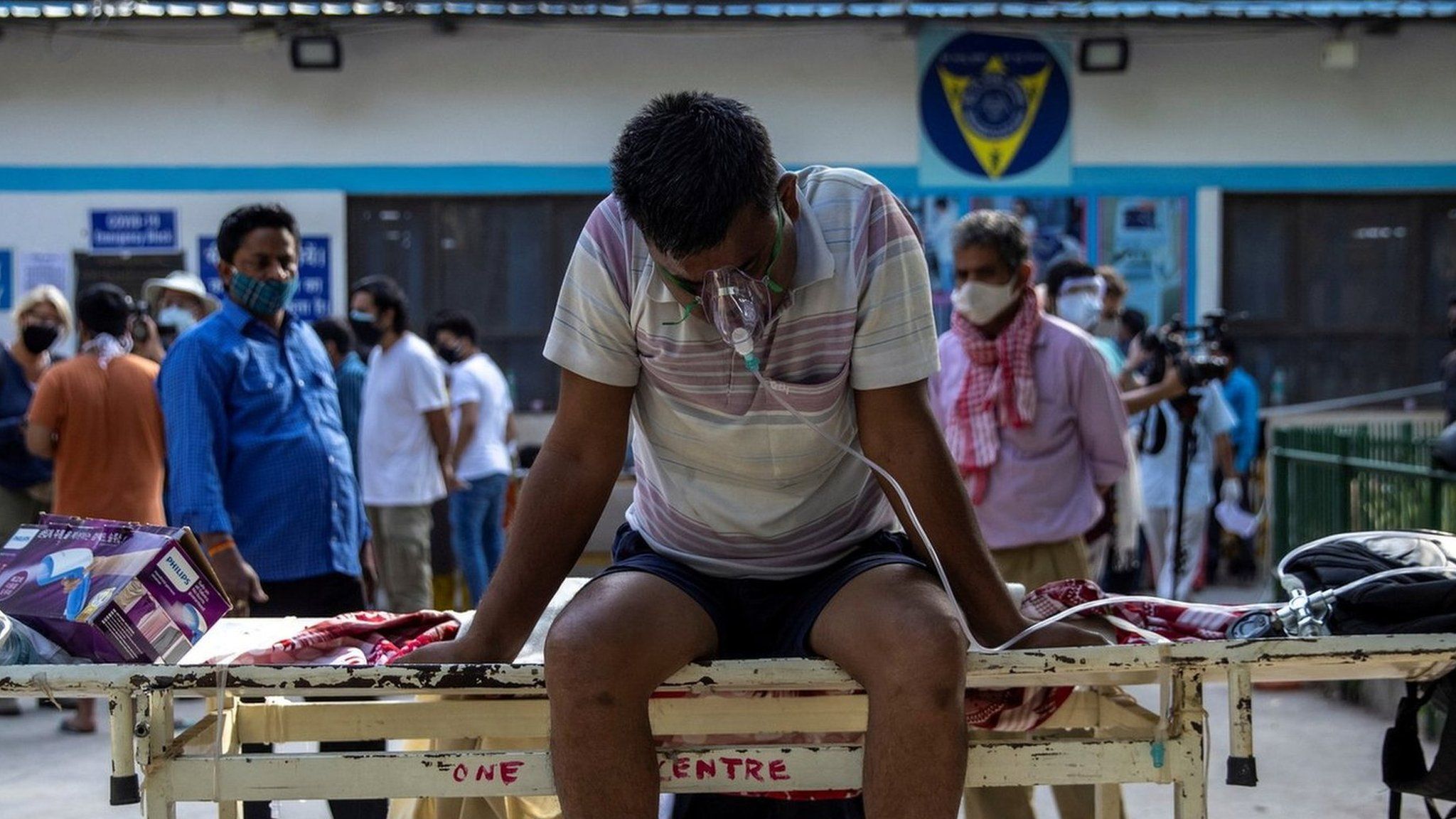 A patient suffering from the coronavirus disease waits to get admitted outside the casualty ward at Guru Teg Bahadur hospital, amidst the spread of the disease in New Delhi, India, April 23, 2021