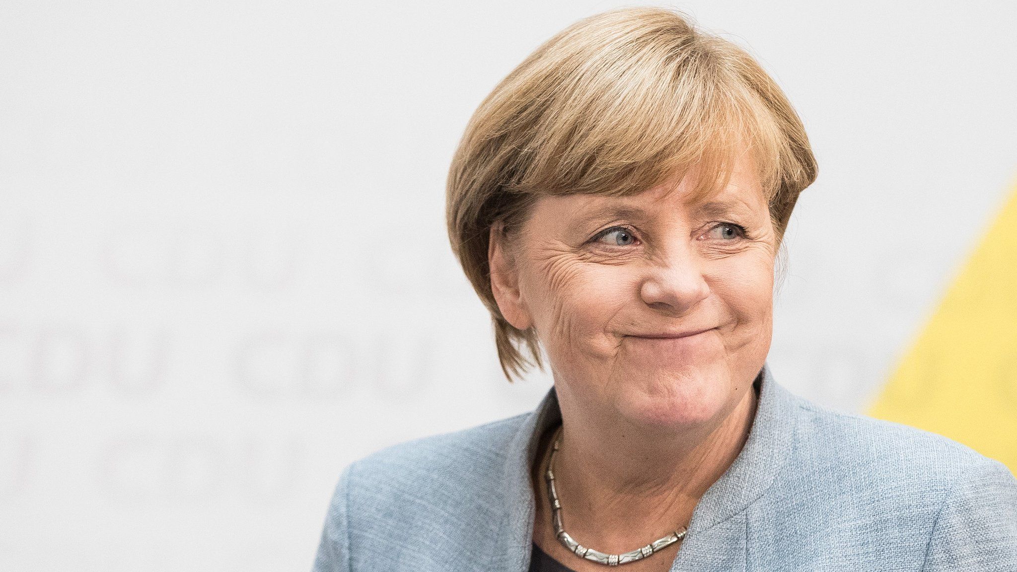 Angela Merkel arrives to give a statement to the media in Berlin (25 September)