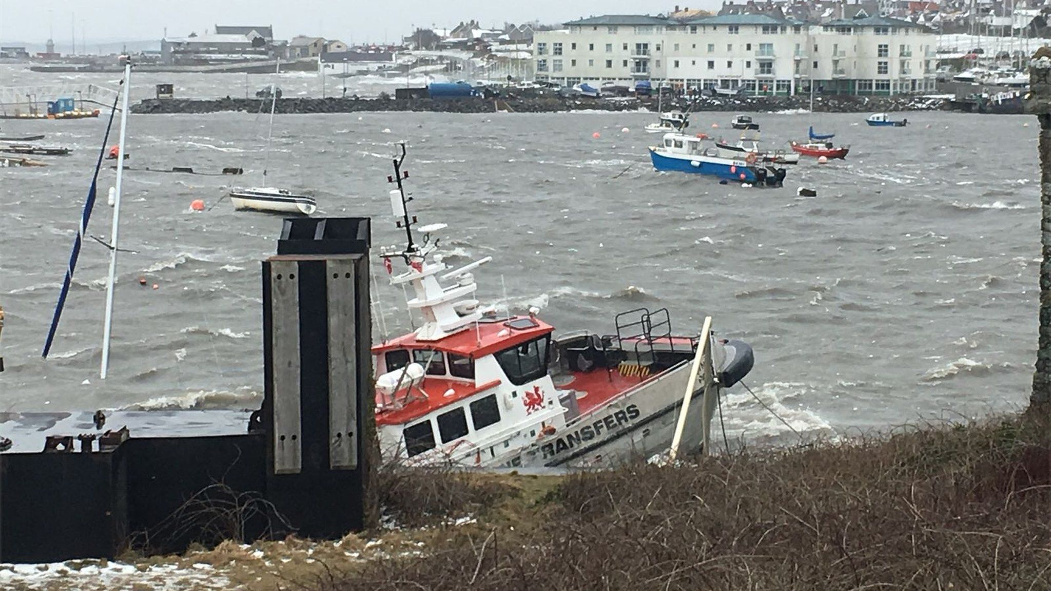 Holyhead marina - boat smashed against marina wall