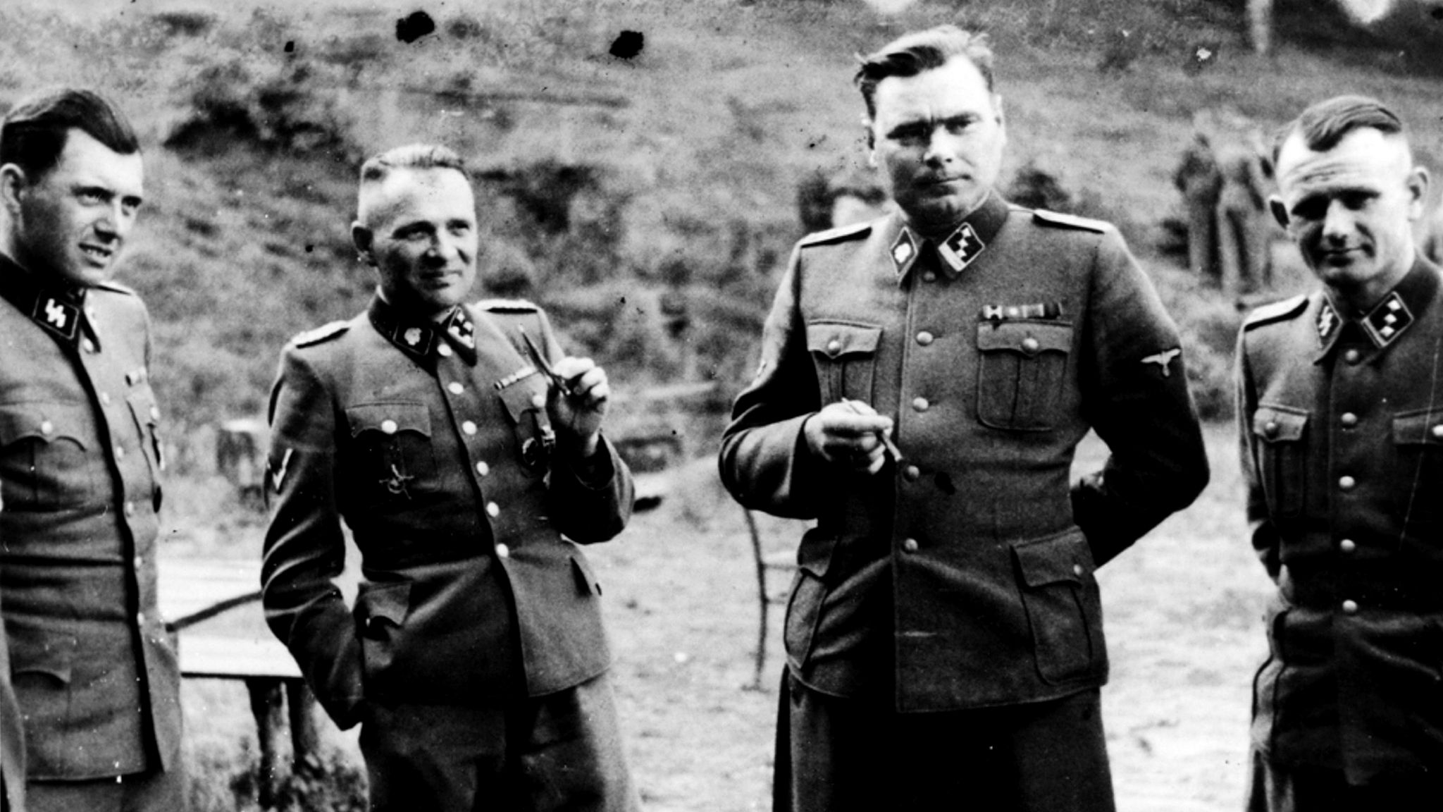 Josef Mengele pictured (left) with other senior Nazi officers