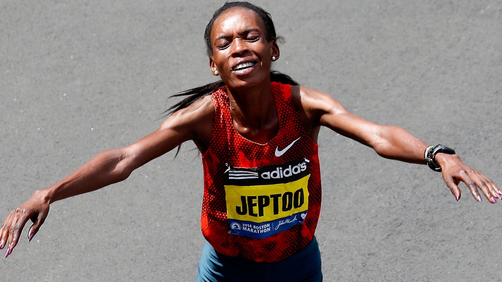 Kenya's Rita Jeptoo finishing the 2014 Boston Marathon