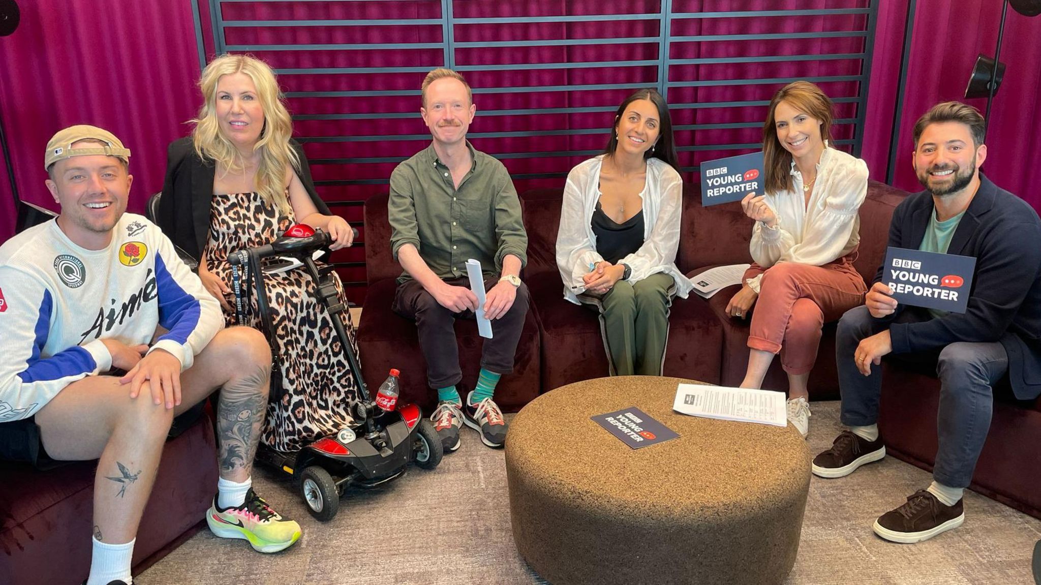 Six of the judges seated. From left to right: Roman Kemp. Nikki Fox, Adam Fleming, Pria Rai, Alex Jones and Ricky Boleto