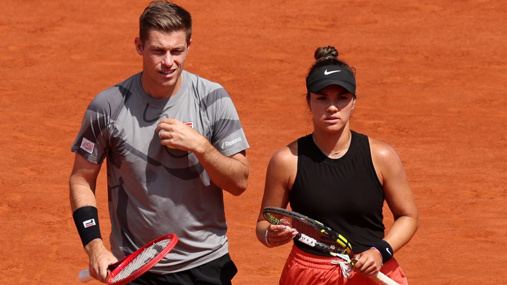 Neal Skupski and Desirae Krawczyk wait to play