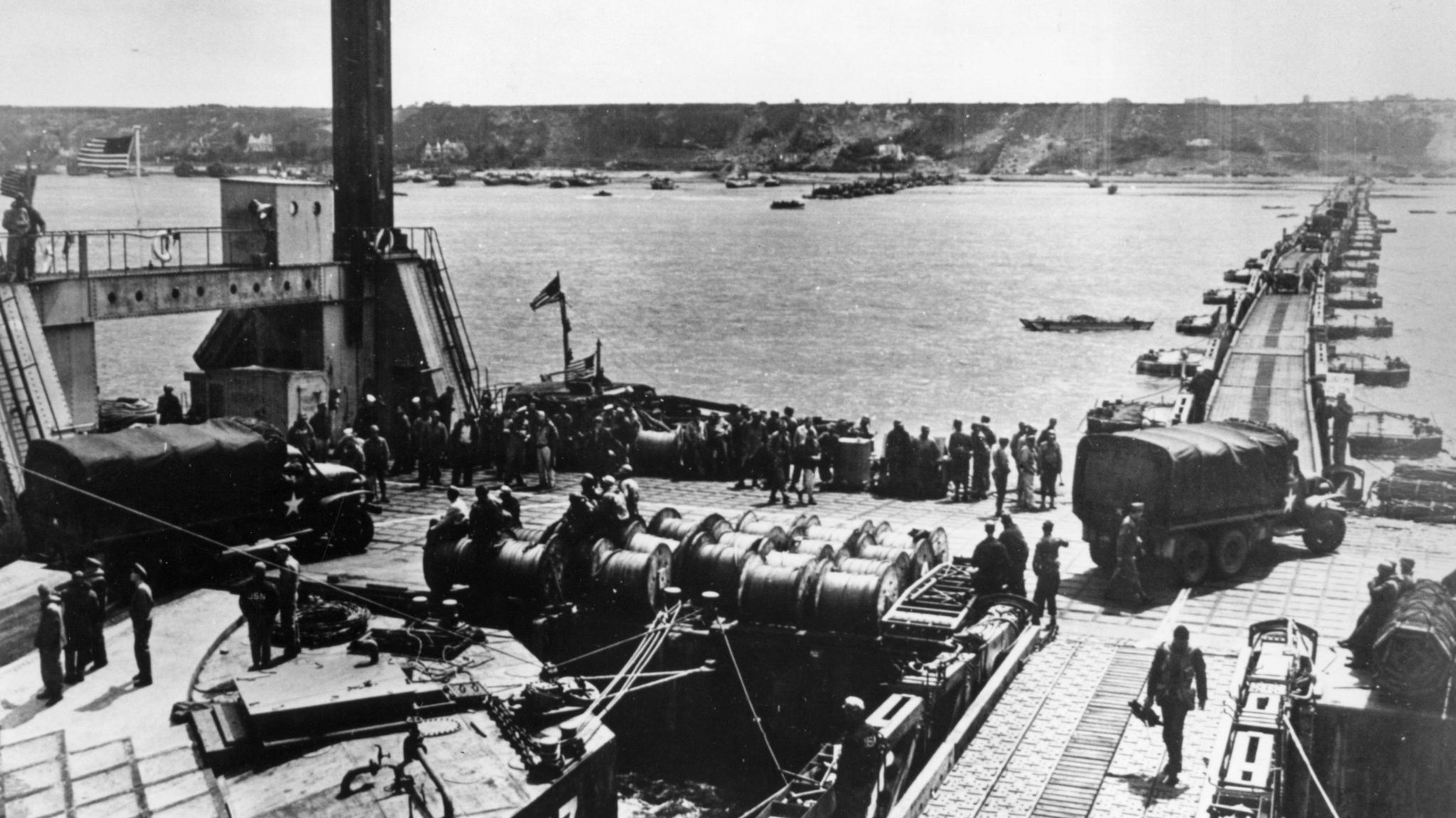 Construction of a Mulberry harbour, and the unloading of supplies for the Allies at Colleville, France