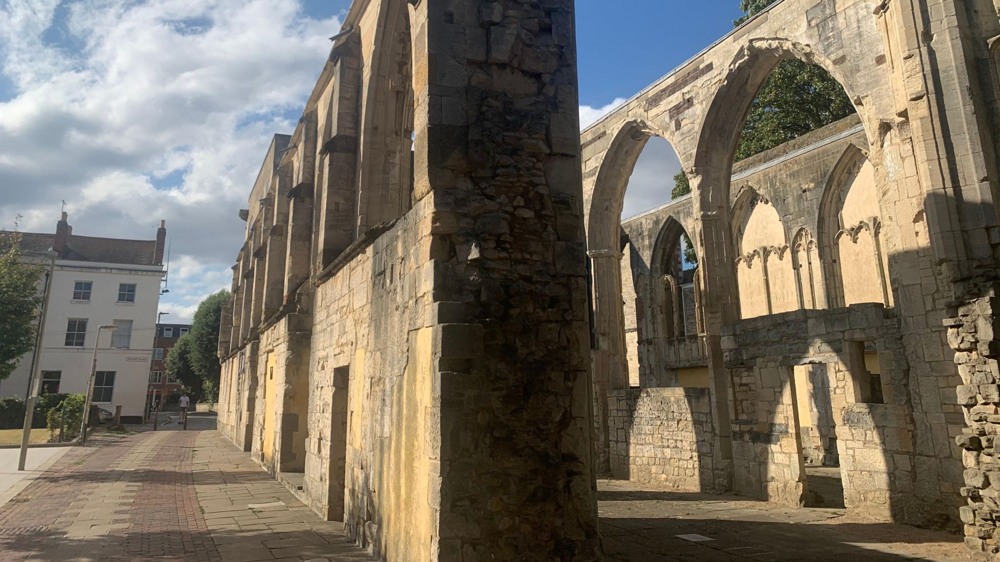 Two adjacent stone walls with arches which form the remains of the Greyfriars monastery.