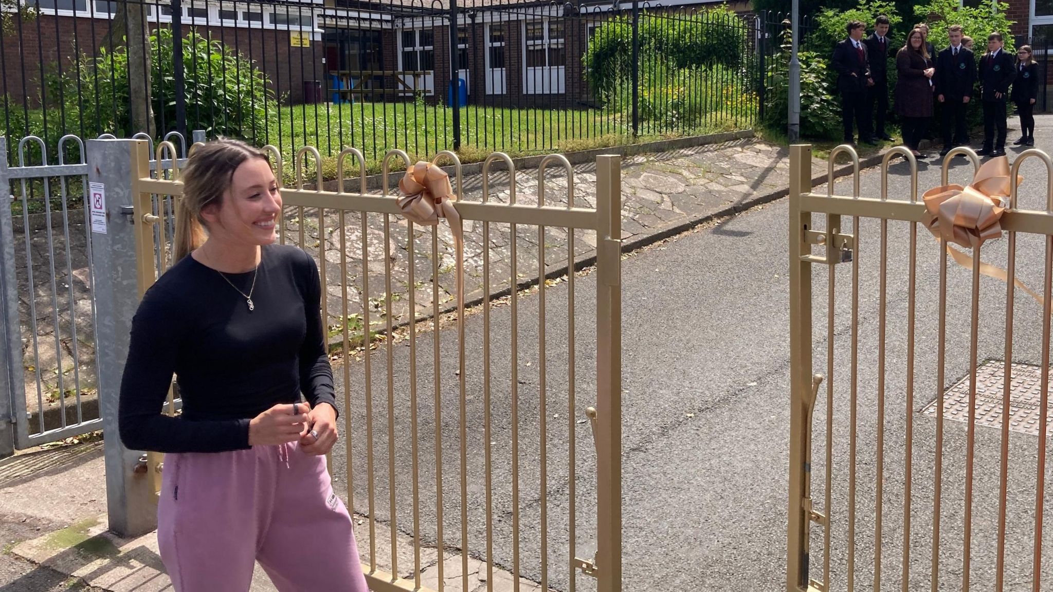 Jade Jones with the golden gates at her former school