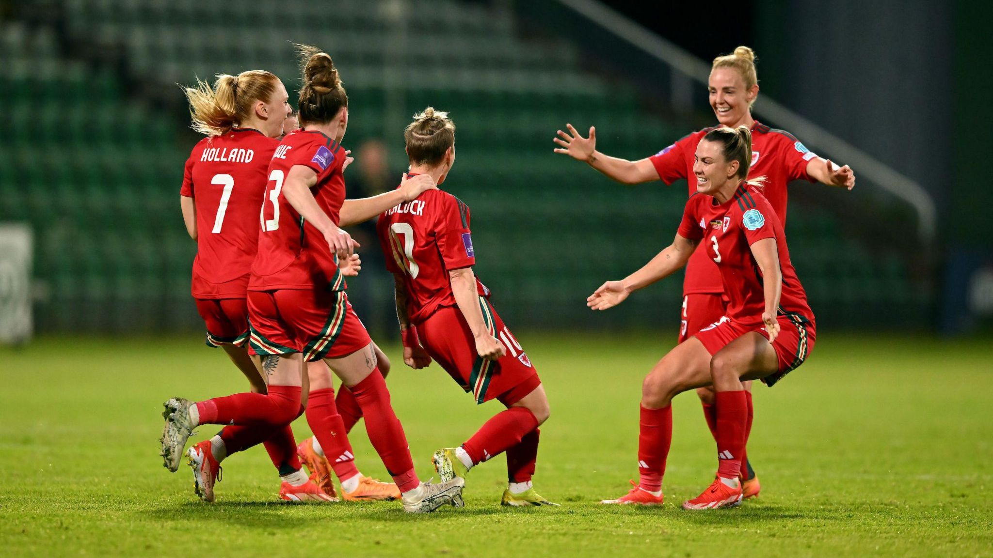Jess Fishlock celebrates her goals with her team-mates