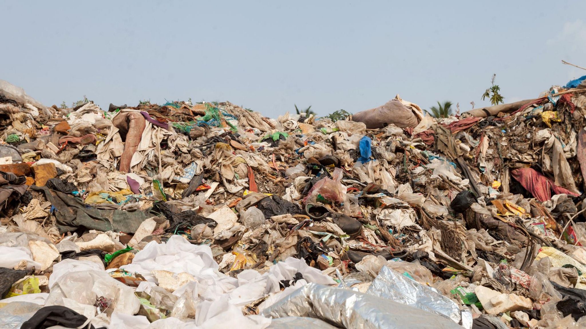 A large pile of rubbish at a landfill site